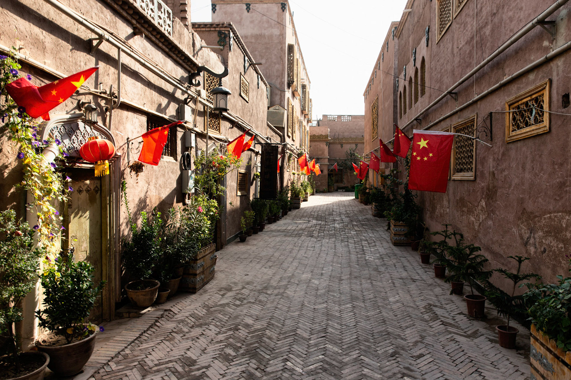 Street in Kashgar's old city, lined with Chinese flags