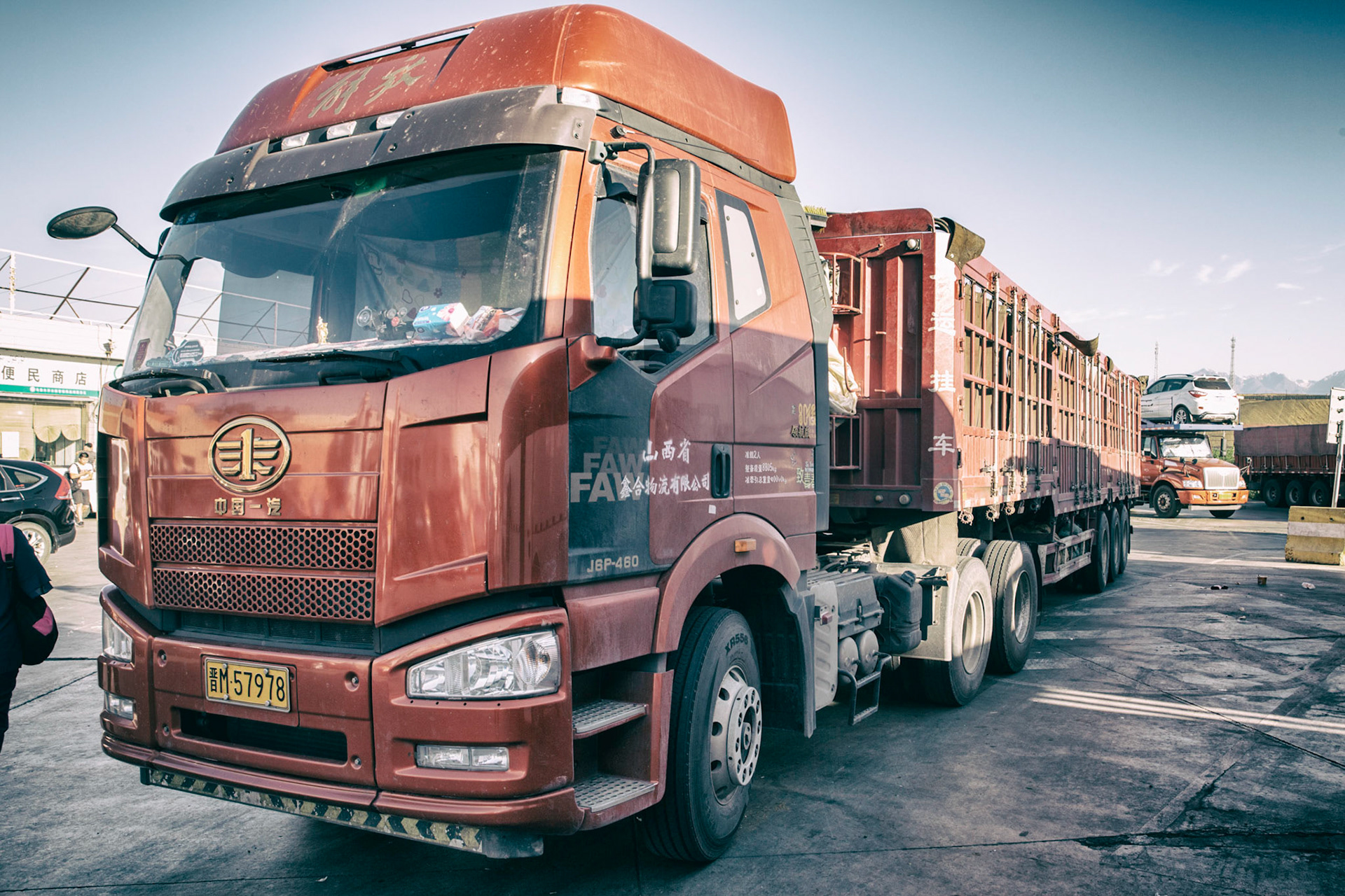 Urumqi, China - september 1, 2018 :  The red truck is the lifeline of the chinese economy, seen everywhere on long-distance roads.