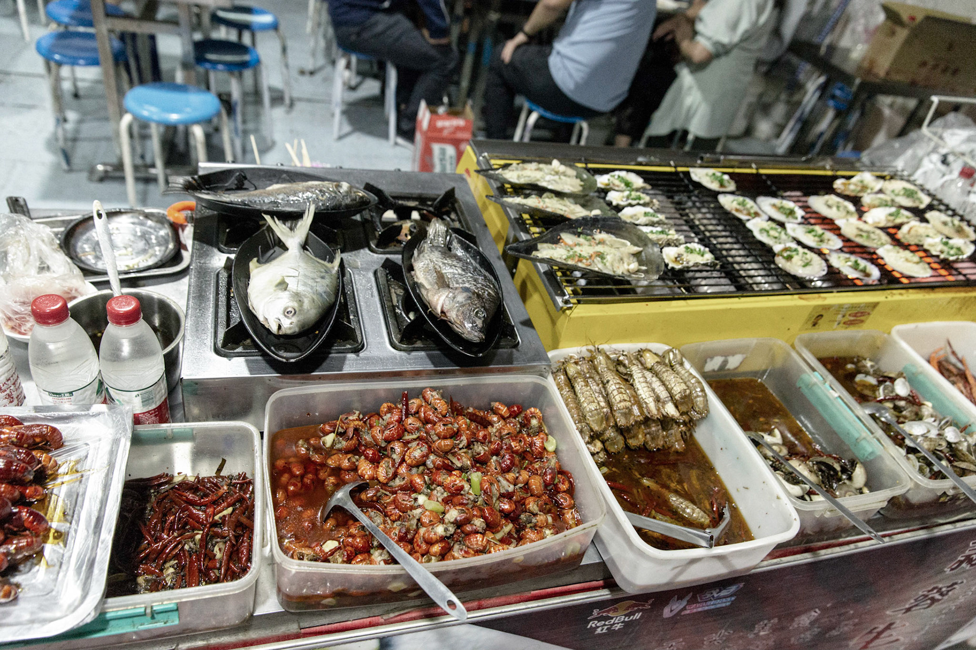 Hotan, China - September 12th 2018 : fresh grilled fish in the Hotan food bazaar