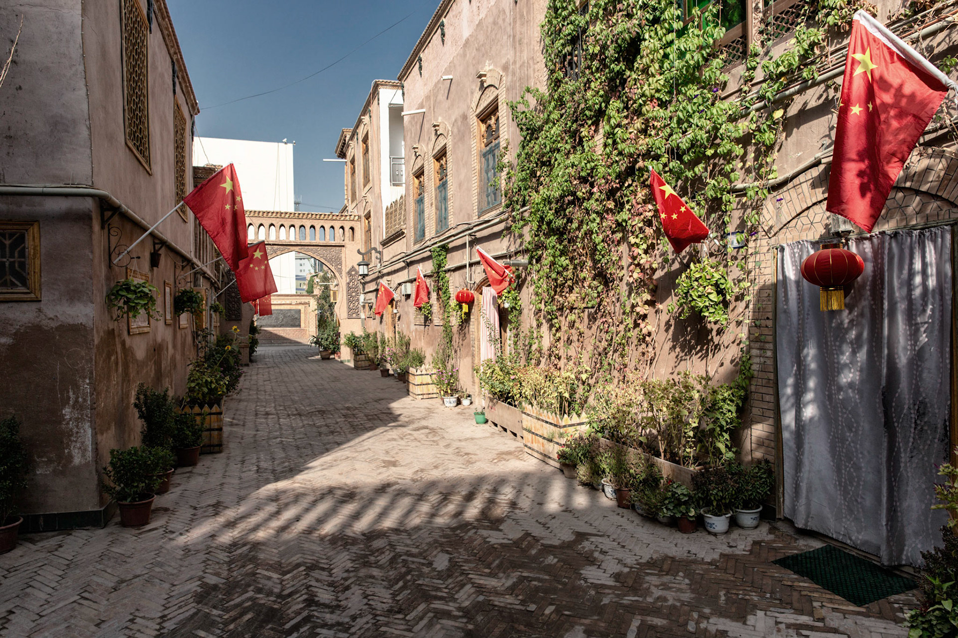 Street in Kashgar's old city, lined with Chinese flags