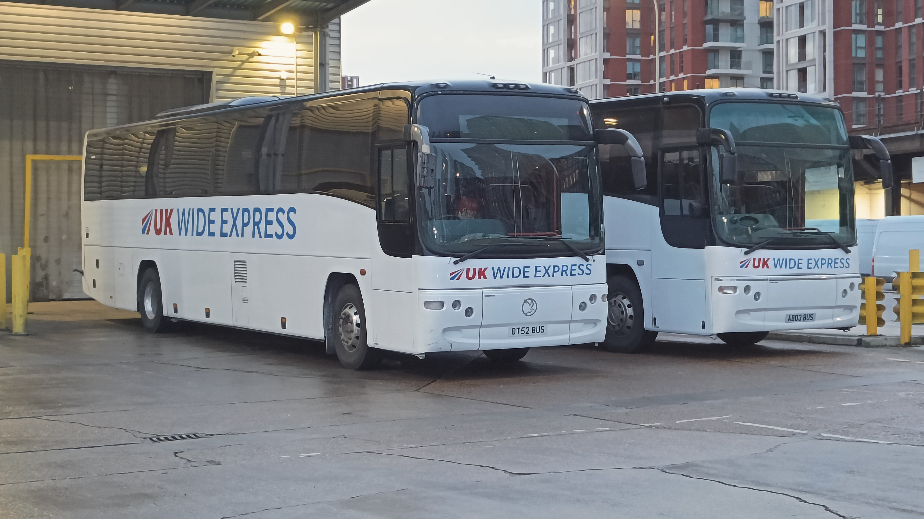 Vinyl decal application on two coaches