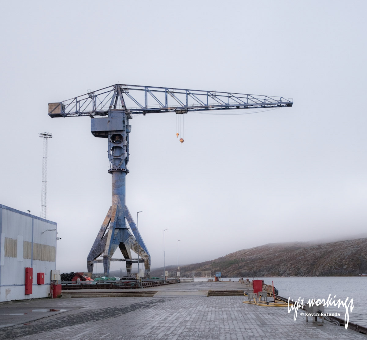 Mighty brutalist crane at the port of Kirkness, Norway