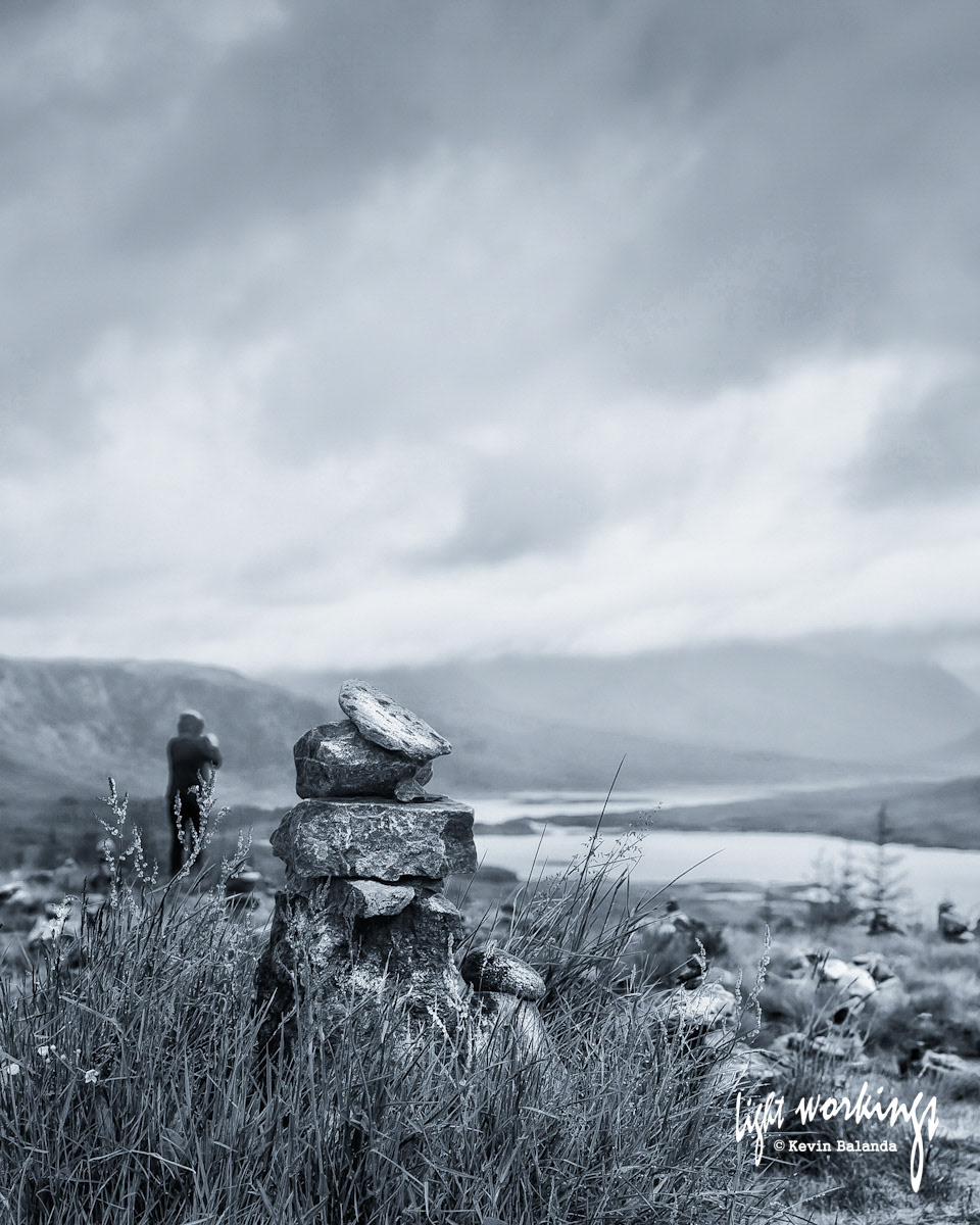 A human, a cairn and the Sottish Highlands