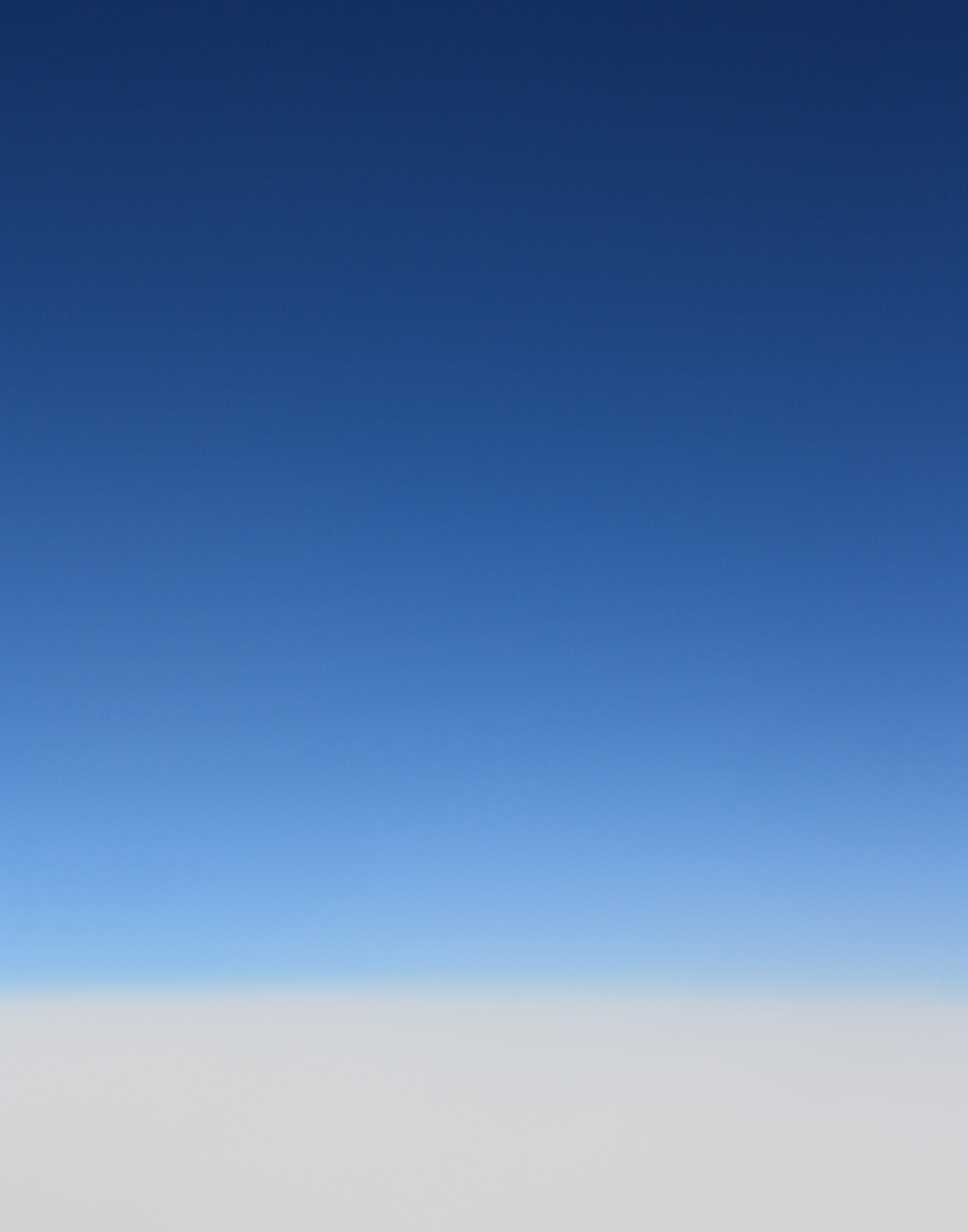A gradient of clouds to blue sky.