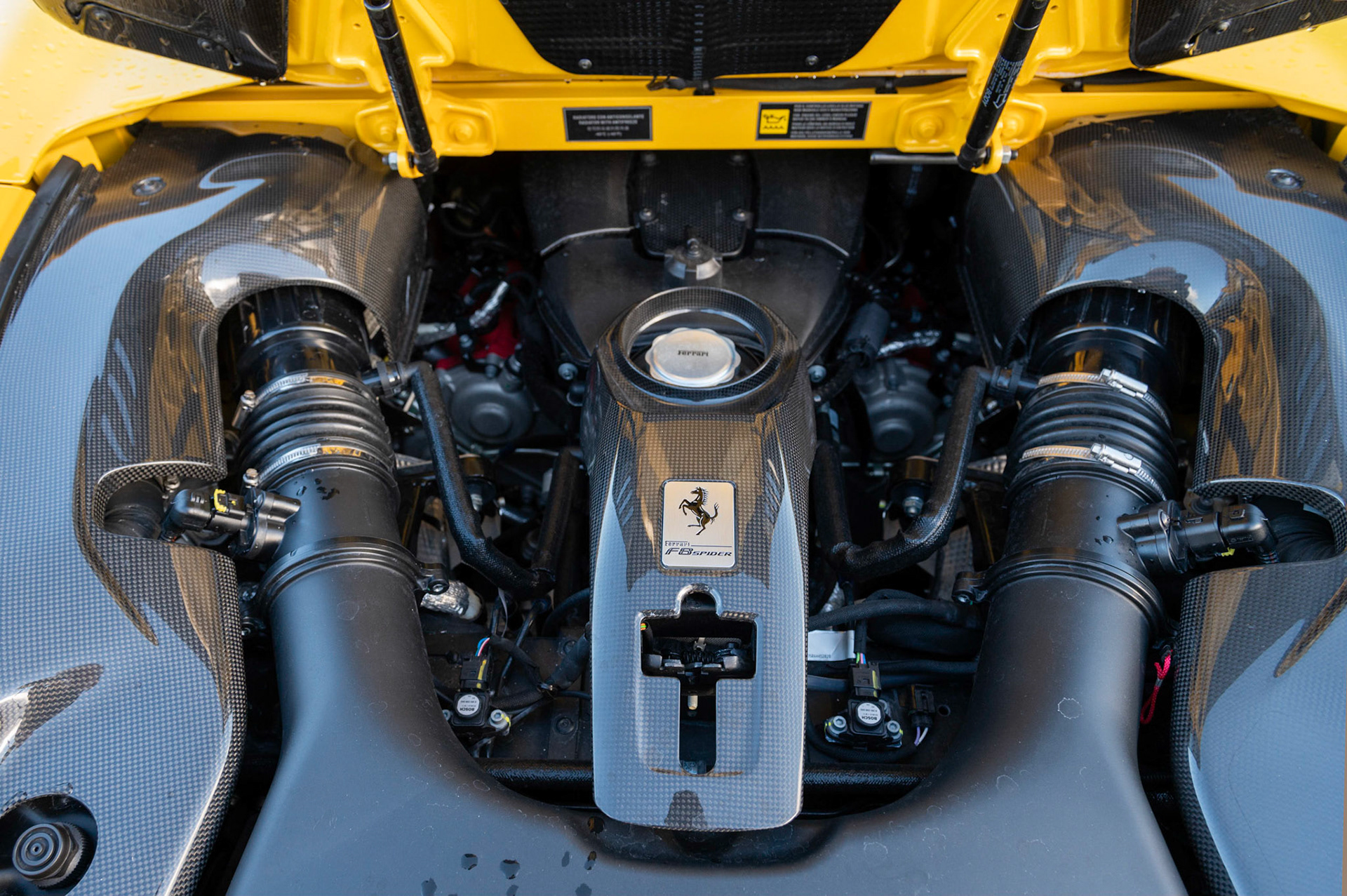 Yellow Ferrari F8 Spider photographed on the Gwent Levels, Castleton, South Wales, UK.