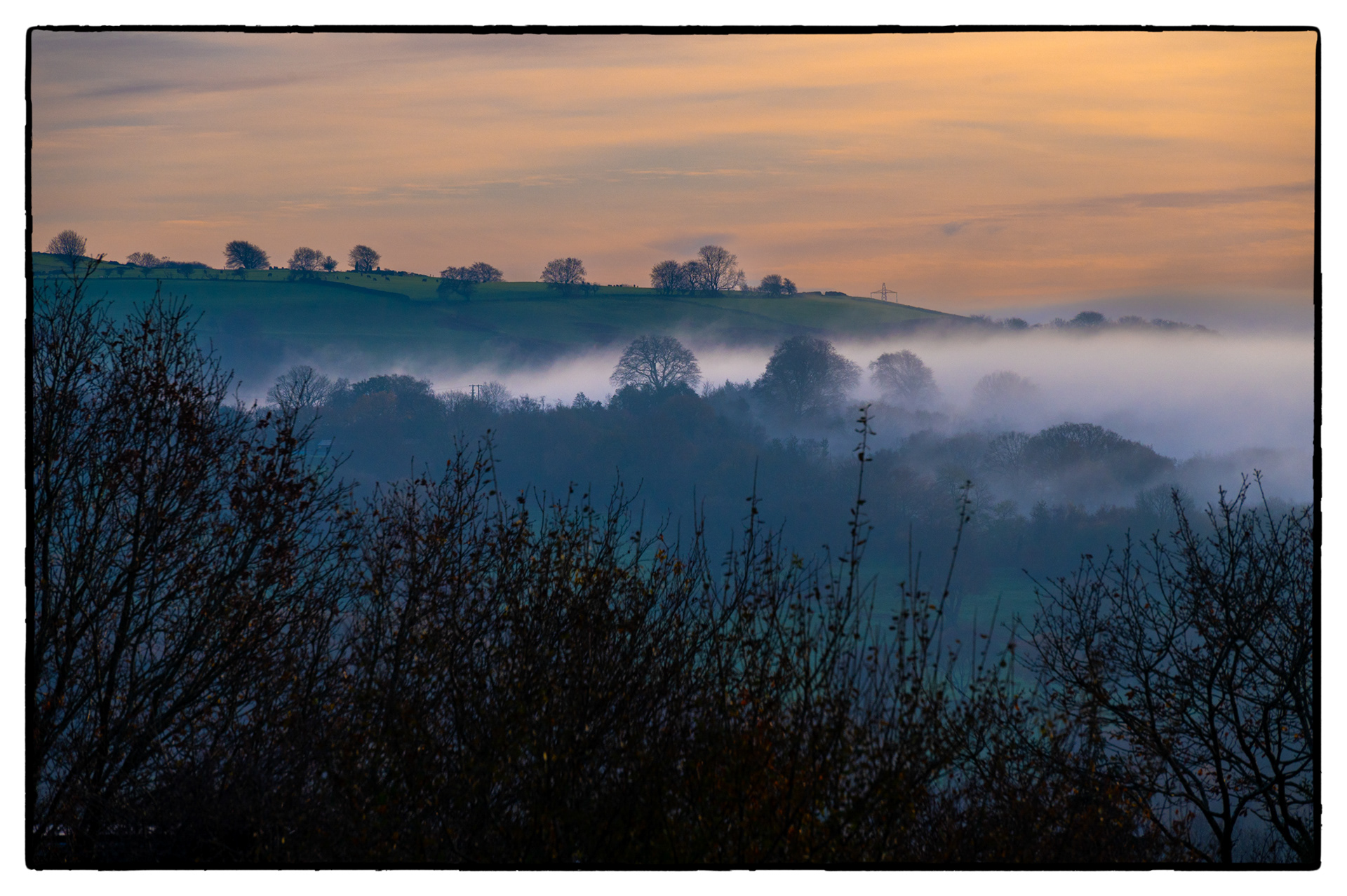 A fog bank lies in The Rhymney Valley, South Wales, UK