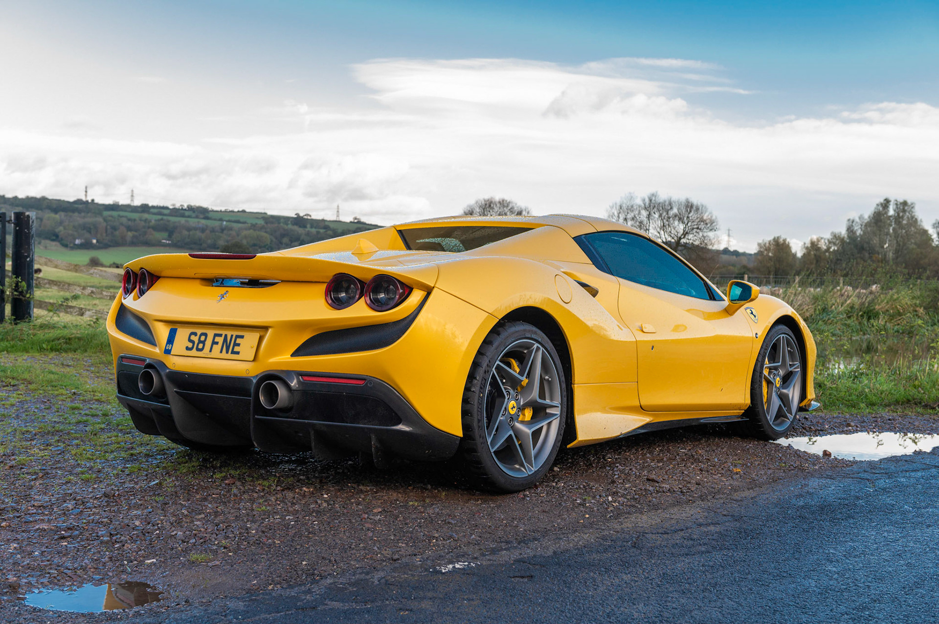 Yellow Ferrari F8 Spider photographed on the Gwent Levels, Castleton, South Wales, UK.