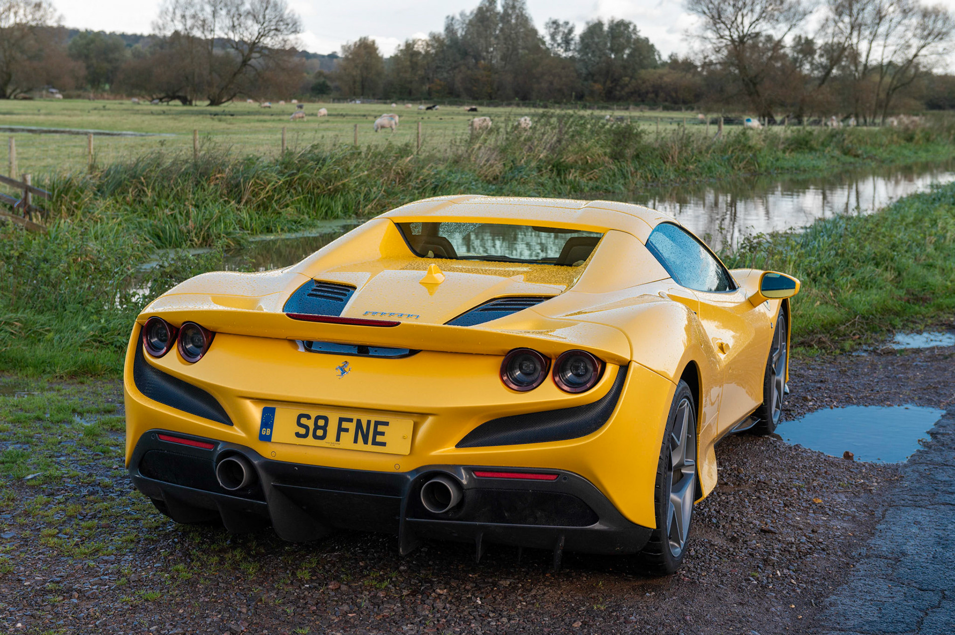 Yellow Ferrari F8 Spider photographed on the Gwent Levels, Castleton, South Wales, UK.