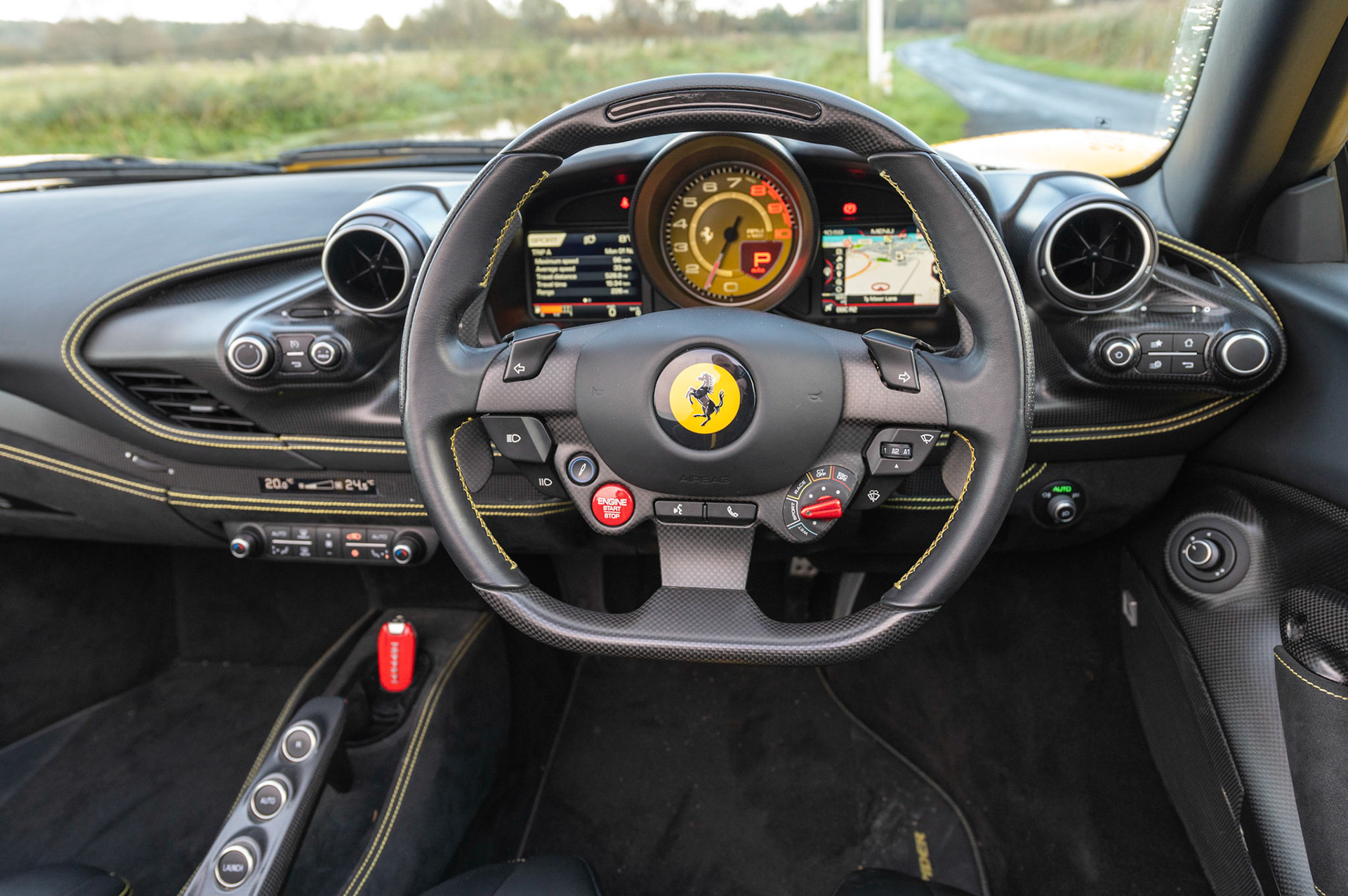 Yellow Ferrari F8 Spider photographed on the Gwent Levels, Castleton, South Wales, UK.