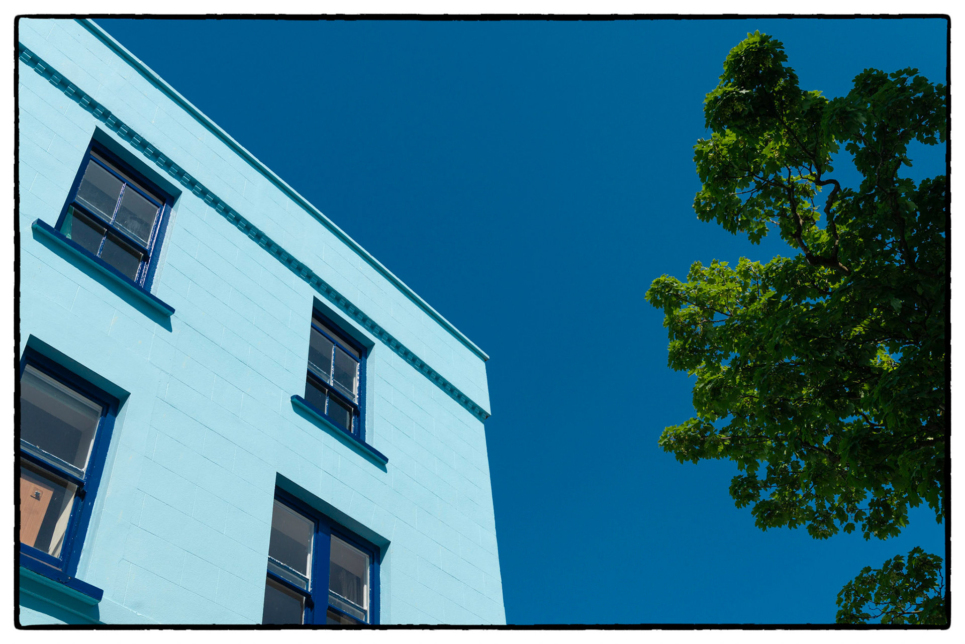 Blue sky and house in the pretty seaside town of Tenby, Pembrokeshire, Wales, UK.