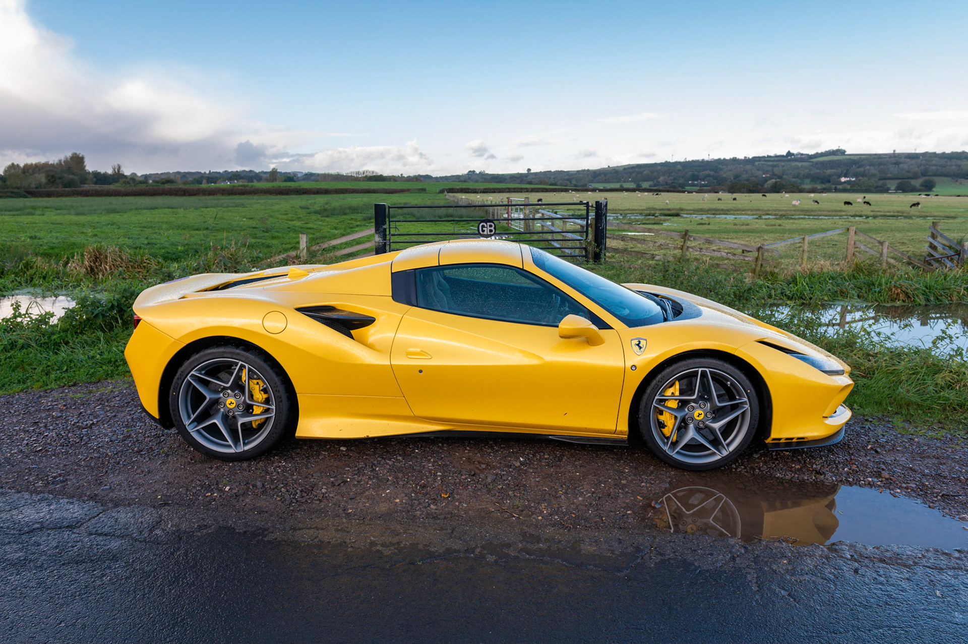 Yellow Ferrari F8 Spider photographed on the Gwent Levels, Castleton, South Wales, UK.