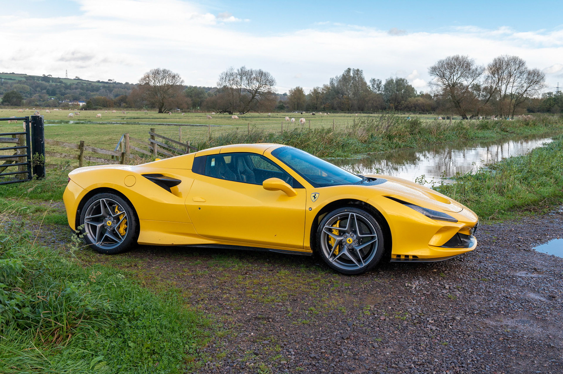 Yellow Ferrari F8 Spider photographed on the Gwent Levels, Castleton, South Wales, UK.