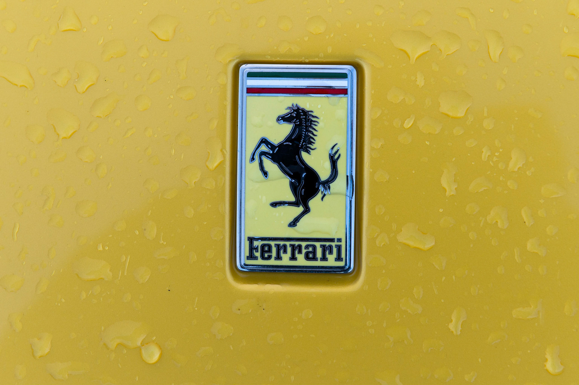 Yellow Ferrari F8 Spider photographed on the Gwent Levels, Castleton, South Wales, UK.