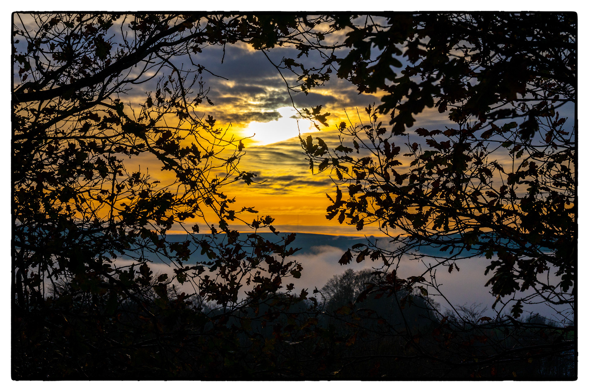 A fog bank lies in The Rhymney Valley, South Wales, UK