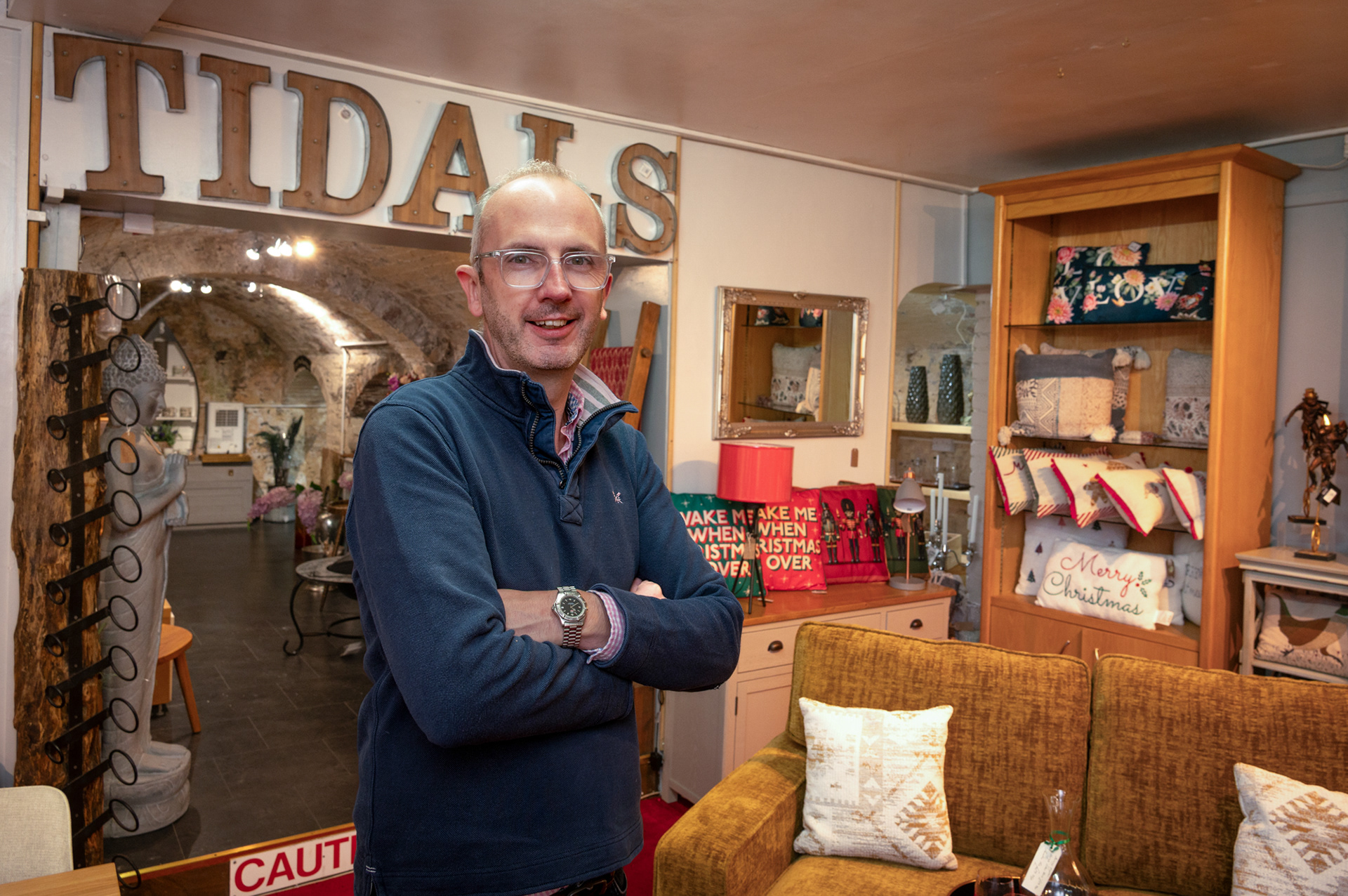 Huw Edwards owner of Tidals Furniture Store on Blackwood High Street. The store is one of Blackwoods oldest, having been formed in 1937 by husband and wife duo Tidal and Bunnie Parsons. In their time the store was more of a Woolworths, selling  everyday household items but changed to selling furniture when Woolworths actually moved into Blackwood. Huw’s Dad Ian who had worked in the family business of T E Edwards Furniture Store at the bottom end of Blackwood High Street bought Tidals in 1973. Huw has worked in the store for the last fifteen years and is the fifth generation of the family to have been involved in furnishing the homes of Blackwood. 13/10/25
