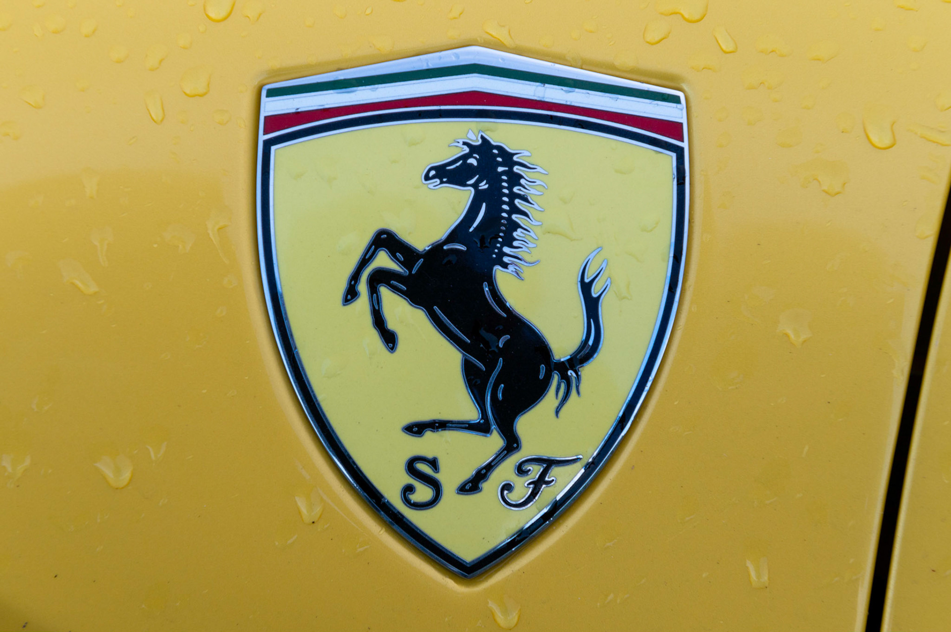 Yellow Ferrari F8 Spider photographed on the Gwent Levels, Castleton, South Wales, UK.