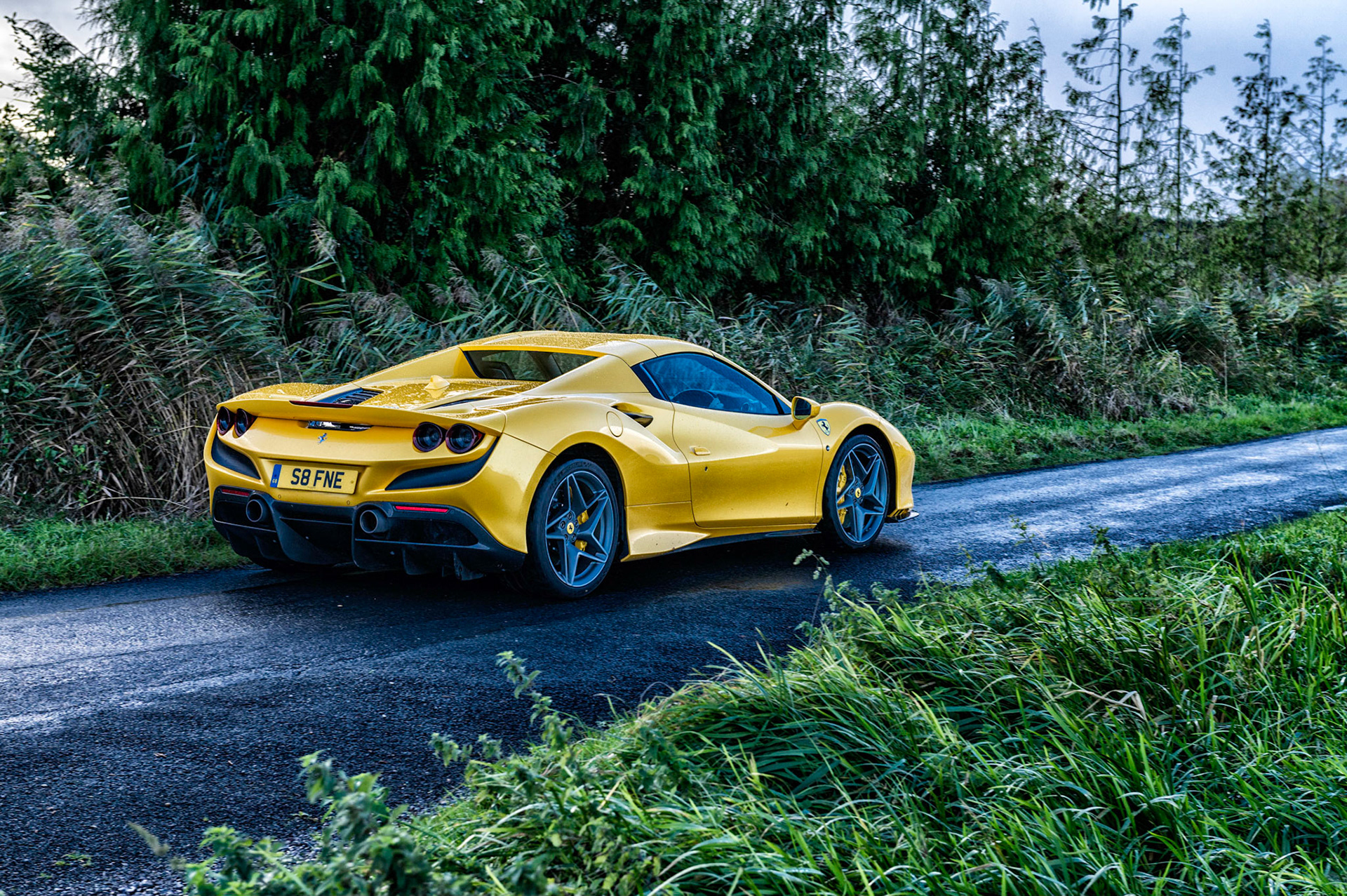 Yellow Ferrari F8 Spider photographed on the Gwent Levels, Castleton, South Wales, UK.