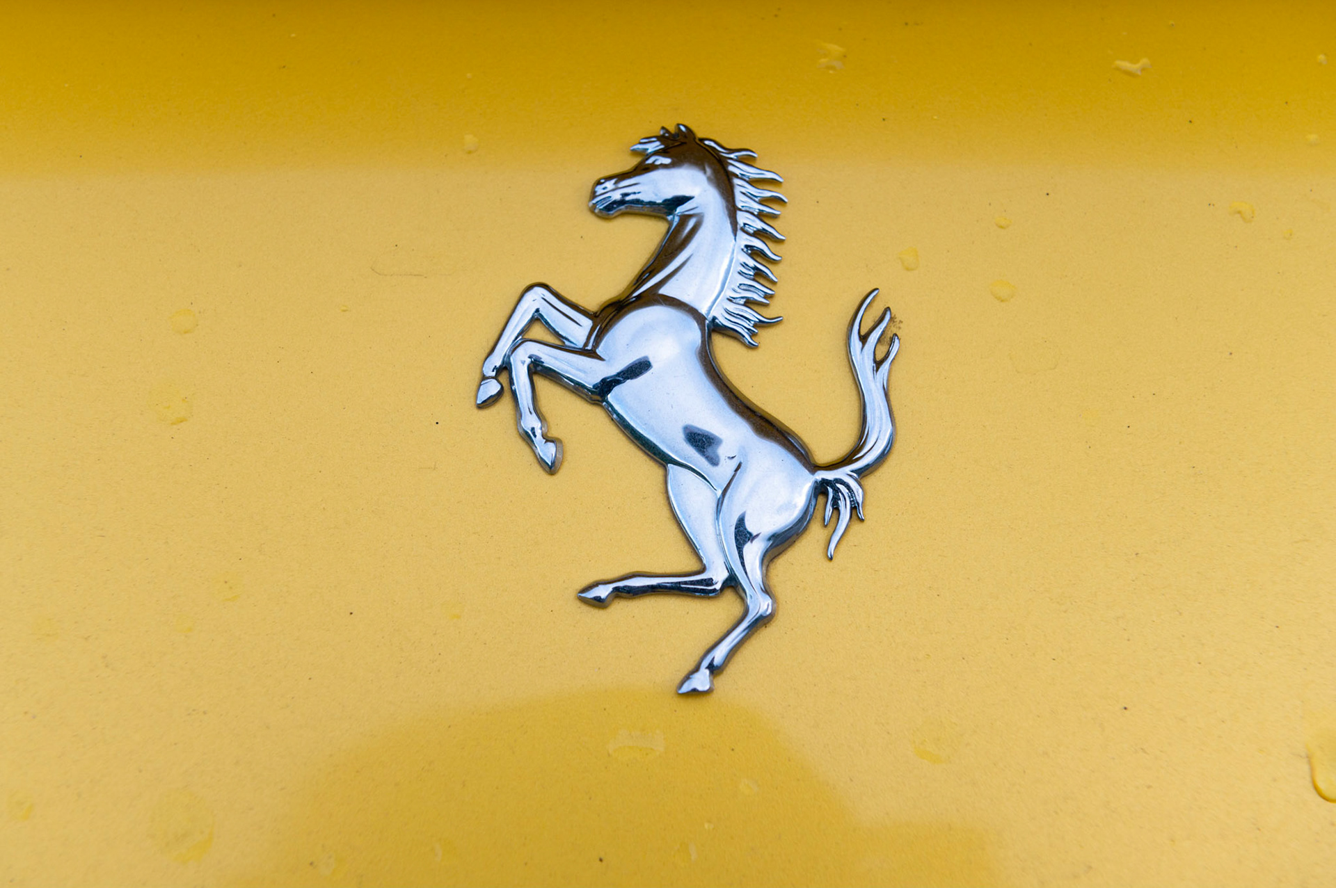 Yellow Ferrari F8 Spider photographed on the Gwent Levels, Castleton, South Wales, UK.