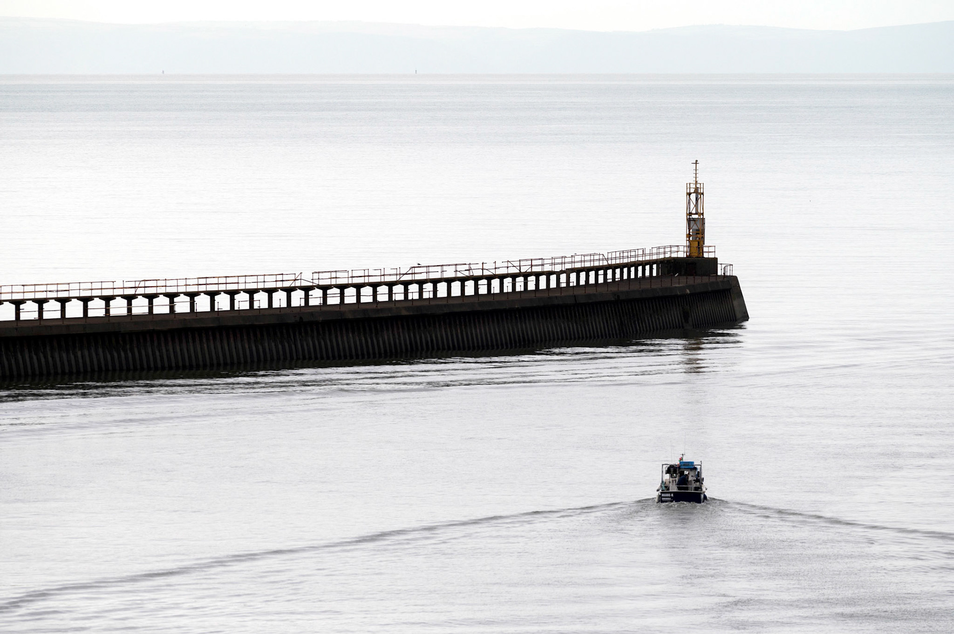 Fishing boats head out for a days fishing in Swansea Bay from Swansea Marina.
