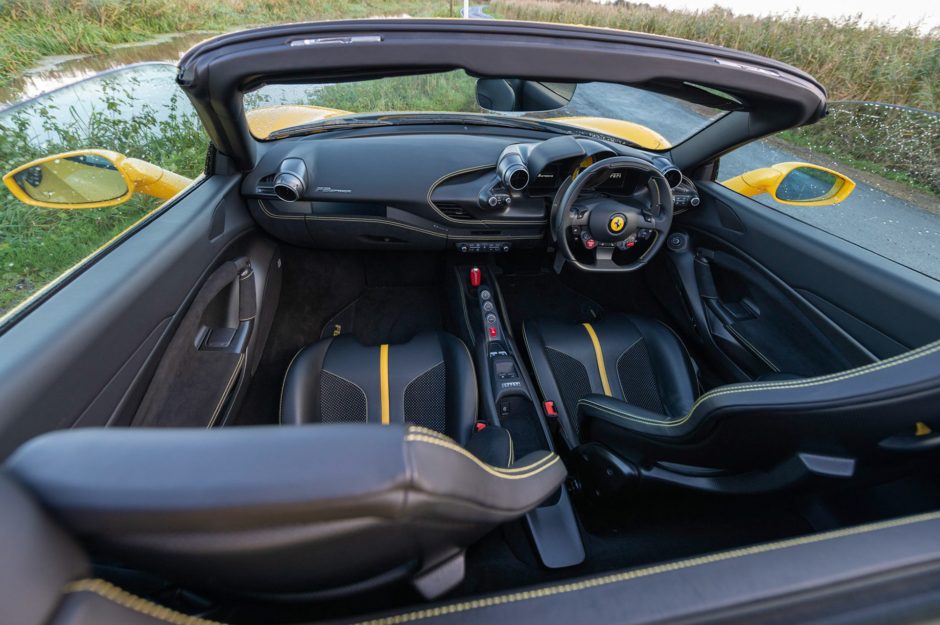 Yellow Ferrari F8 Spider photographed on the Gwent Levels, Castleton, South Wales, UK.