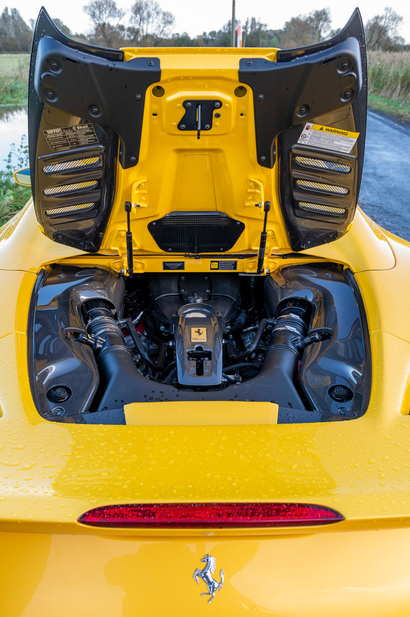 Yellow Ferrari F8 Spider photographed on the Gwent Levels, Castleton, South Wales, UK.