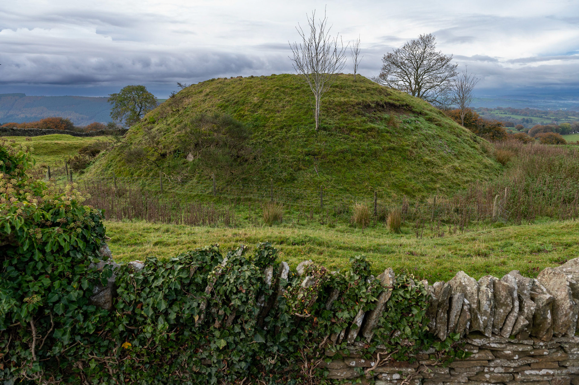 St Tudor’s Mound alongside St Tudors Church on top of Mynyddislwyn mountain, South Wales, UK. A pagan site dating back to the Dark Ages, circa 5th-7th century, during the Middle Ages a small motte and Bailey castle was built on top of it but nothing now remains of this. Various legends claim it to be the burial place of St Tudor and also the burial place of Roman  soldiers.