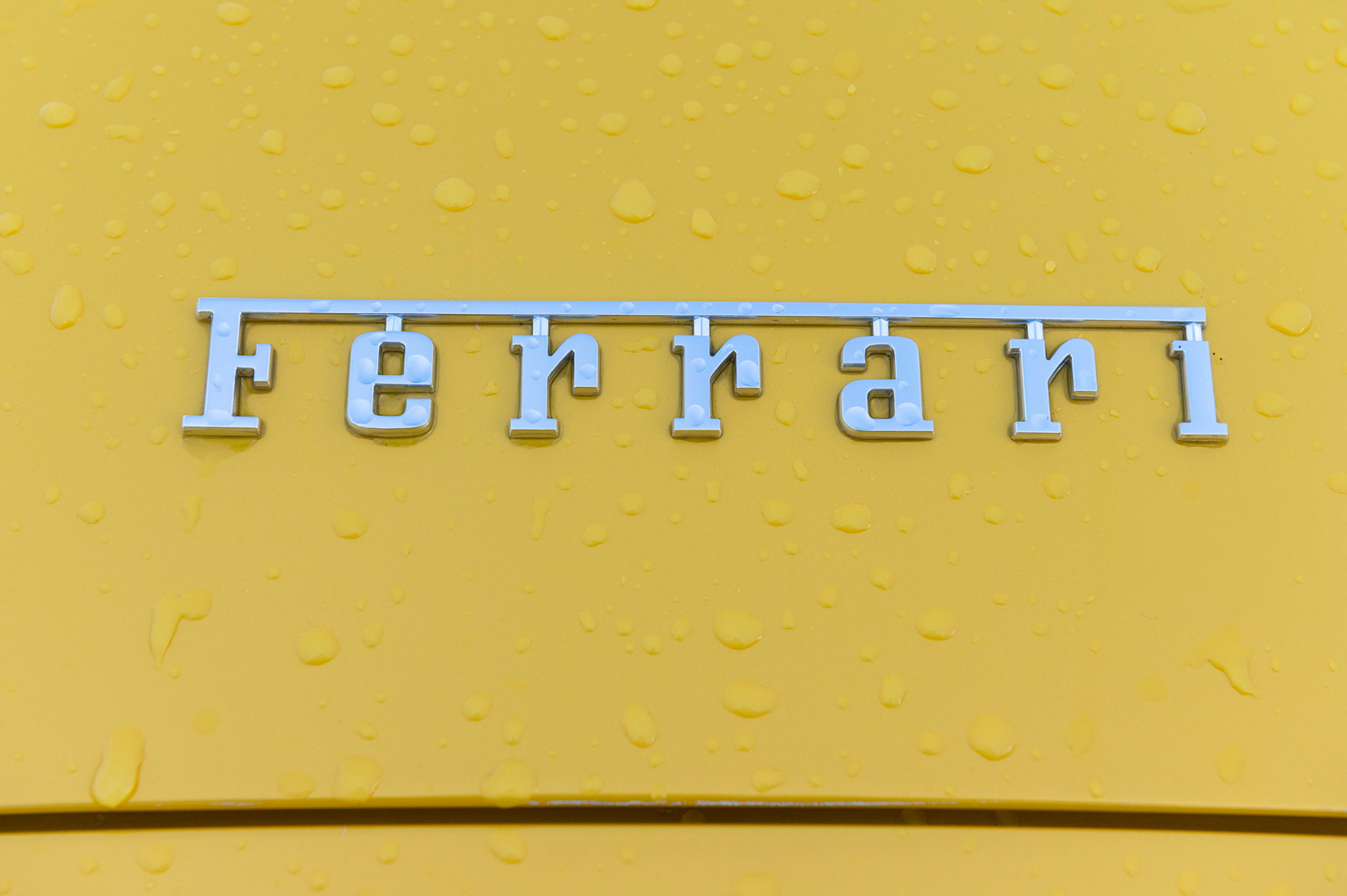 Yellow Ferrari F8 Spider photographed on the Gwent Levels, Castleton, South Wales, UK.