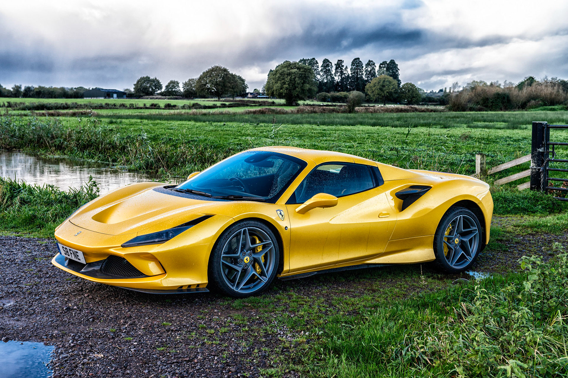 Yellow Ferrari F8 Spider photographed on the Gwent Levels, Castleton, South Wales, UK.