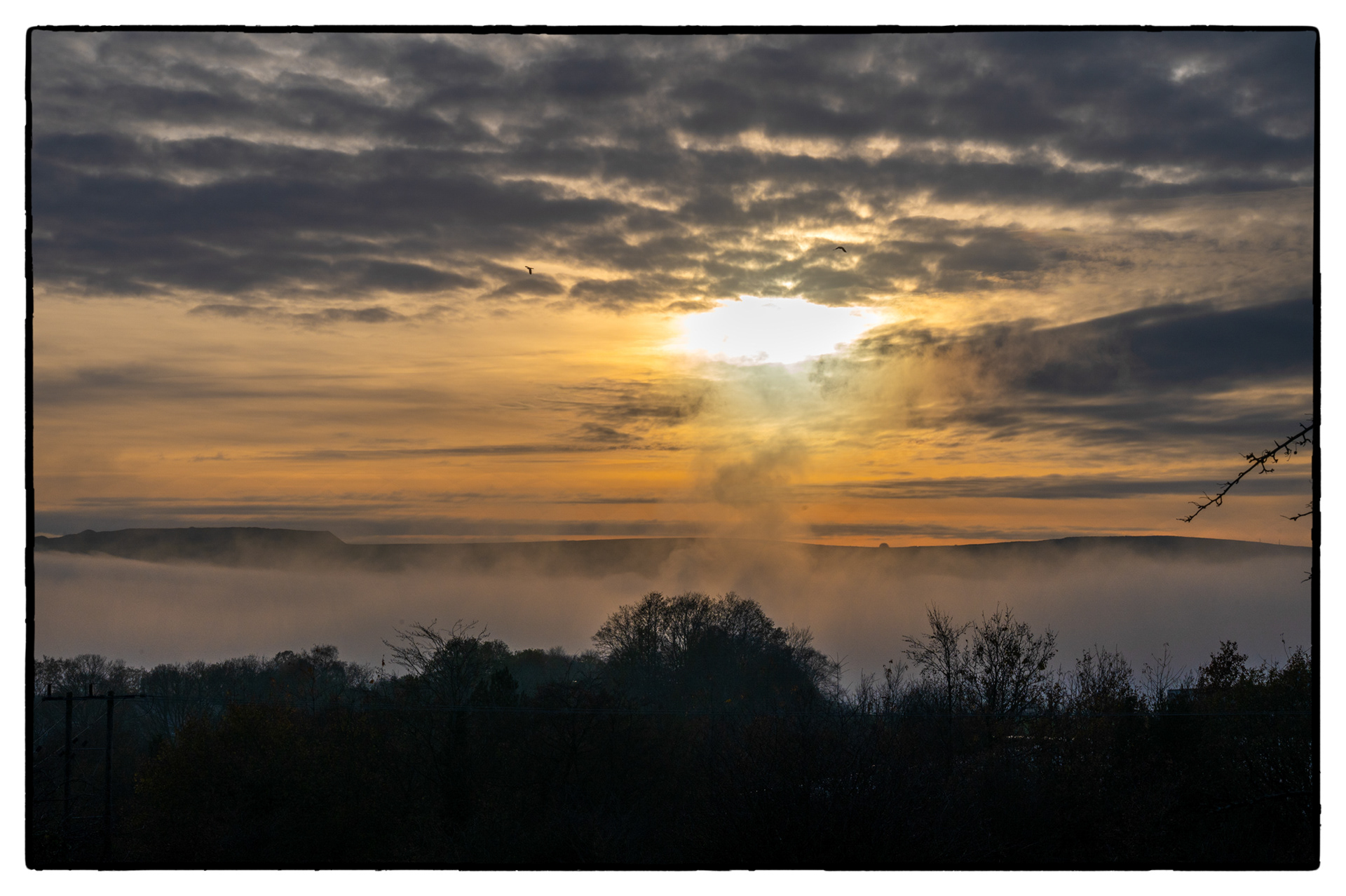 A fog bank lies in The Rhymney Valley, South Wales, UK