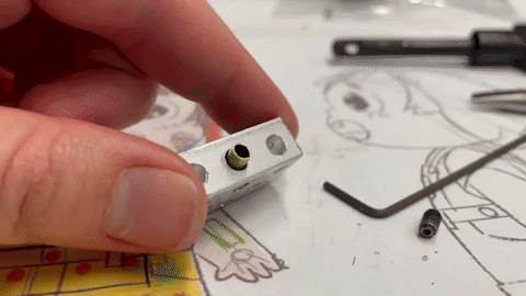 This is a demonstration of how the brass stock fits into the aluminum block and is tightened with set screws. This system allows limbs to be interchangeable.