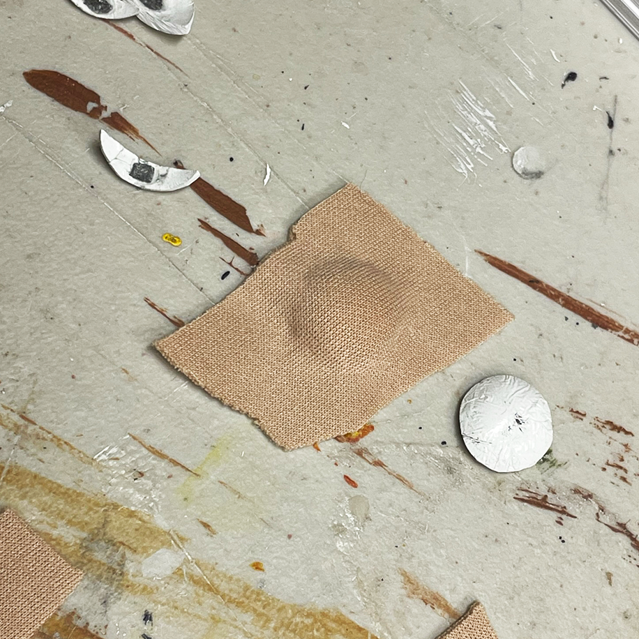 Fabric stretched over a closed eyelid