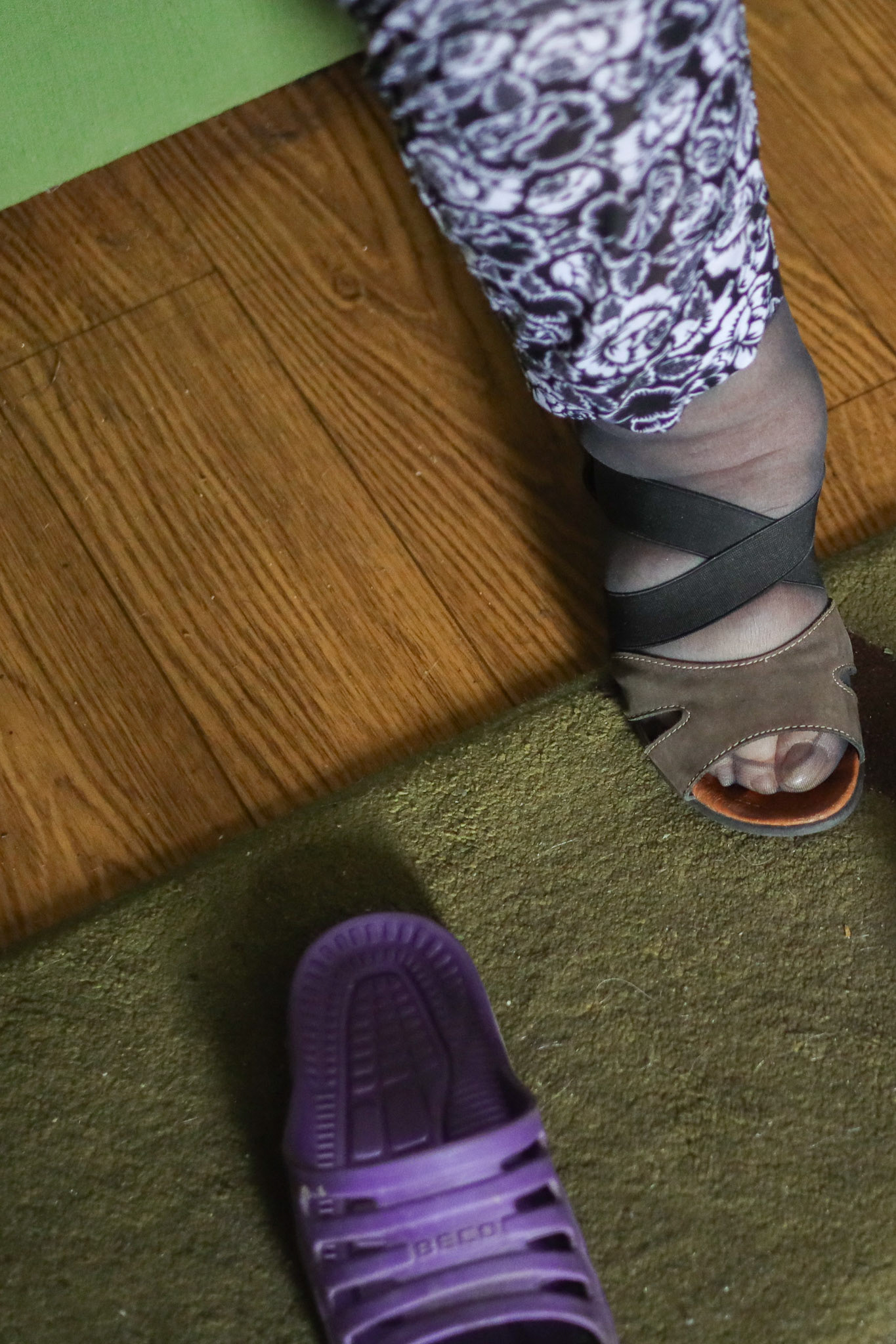 80 Summer lady Teresa puts on her shoes to go out for a walk (6/2023).