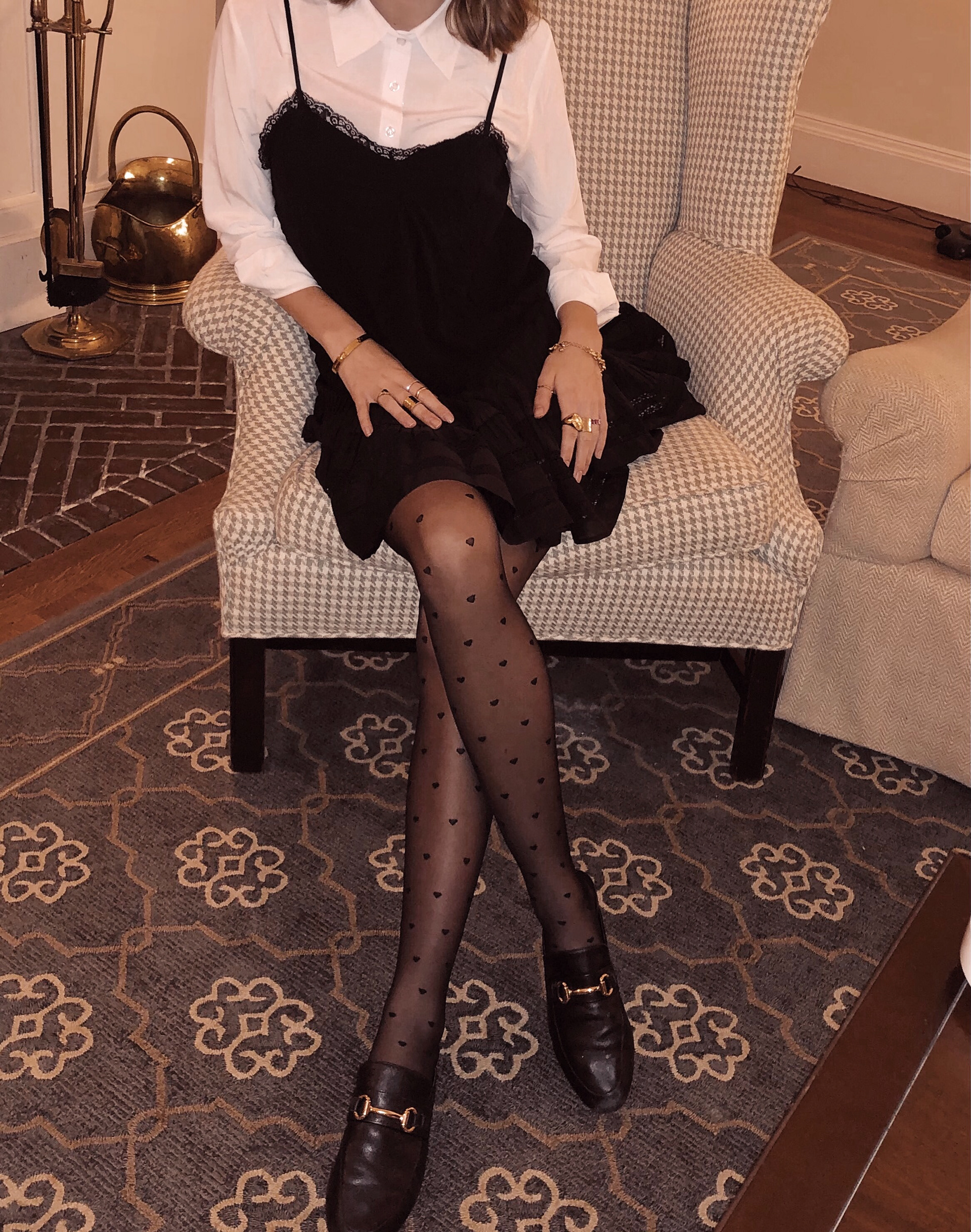 sensual black tights, skirt, and lacy tank juxtaposed with a crisp, white masculine collared shirt