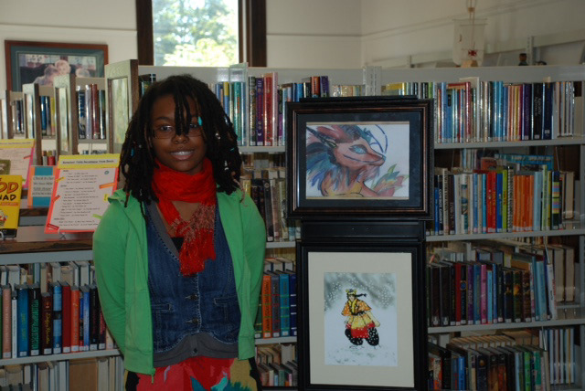 Me at Barnstead Library with a watercolor Dragon painting and character from my Legend of Shintaro comic