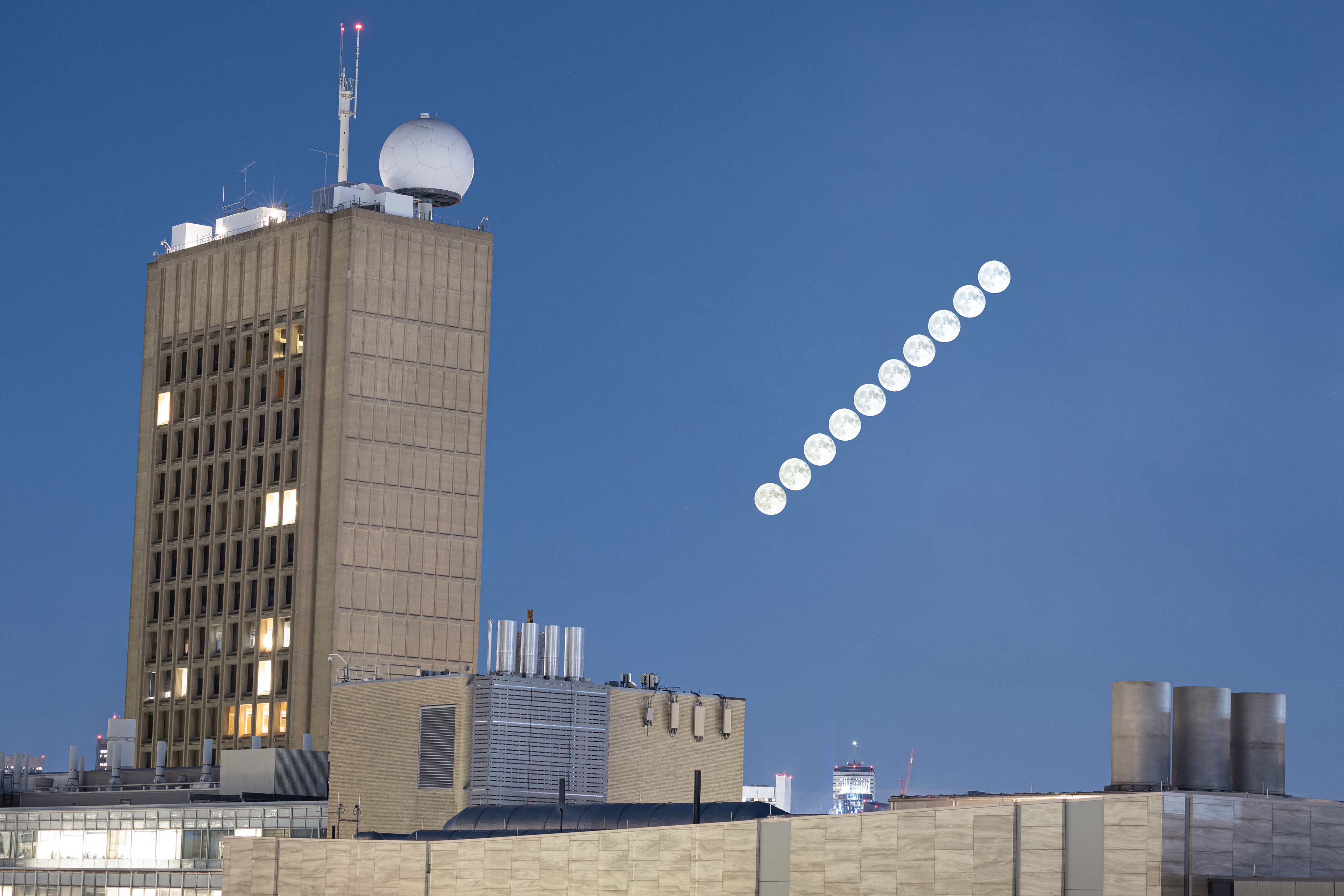 Time series of the super blue moon next to the MIT Green Building. Cambridge, MA.