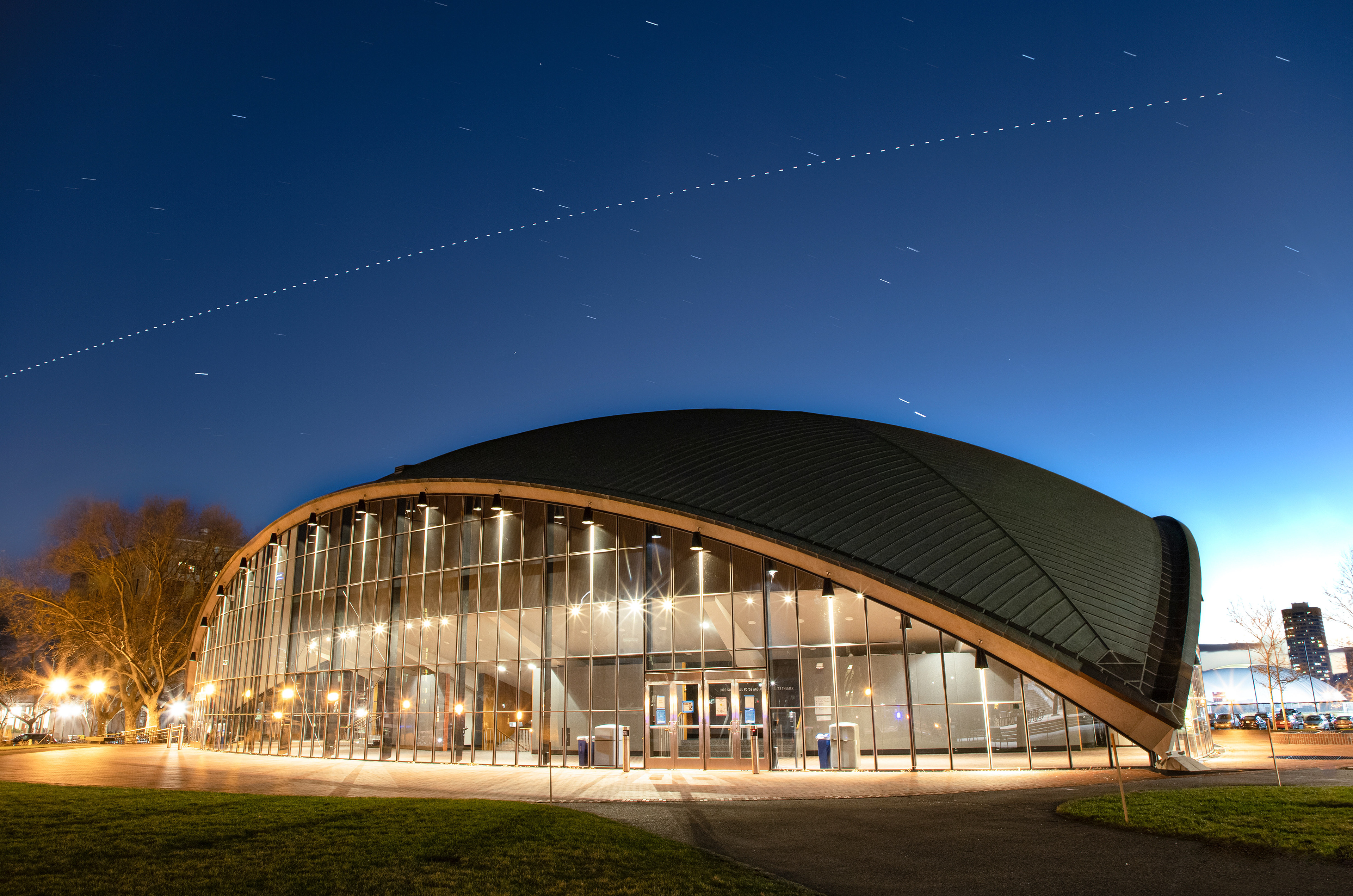 The international space station flies over Kresge Auditorium while a conjunction between Jupiter and Saturn appears just above the roof. Cambridge, MA.