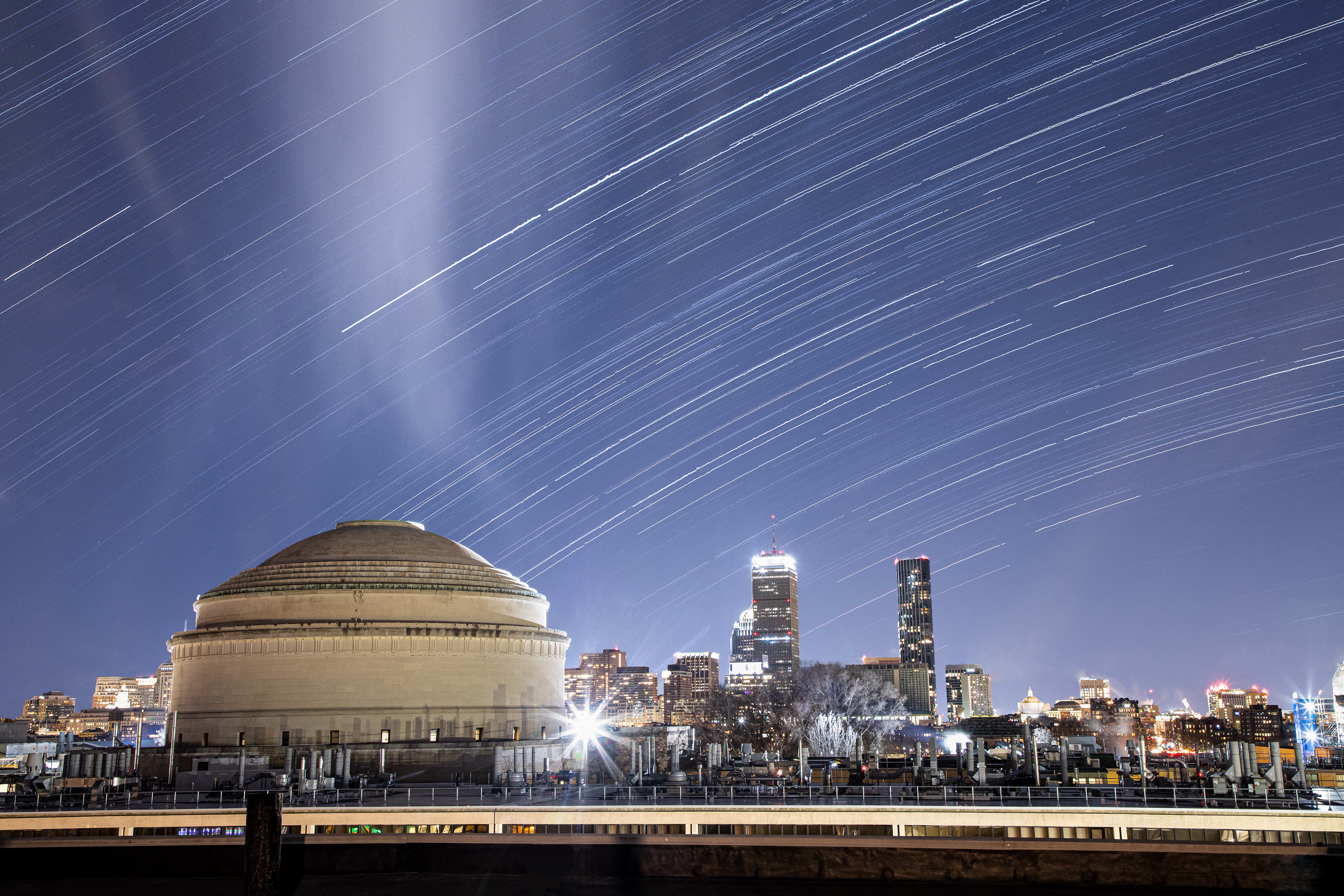 Star trails over the MIT Dome and Prudential Tower. Cambridge, MA.