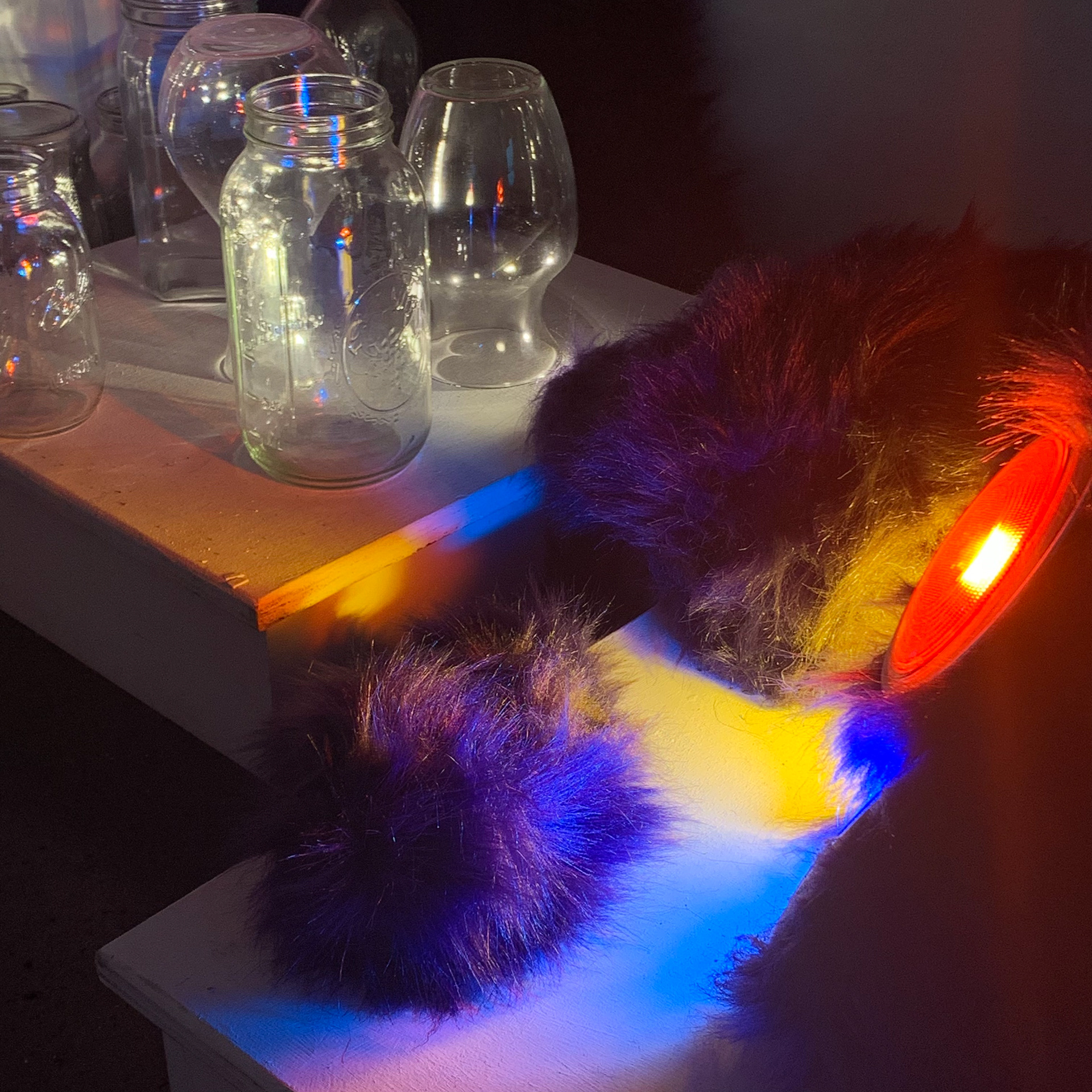 Detail of lights refracting glass, which can be moved around