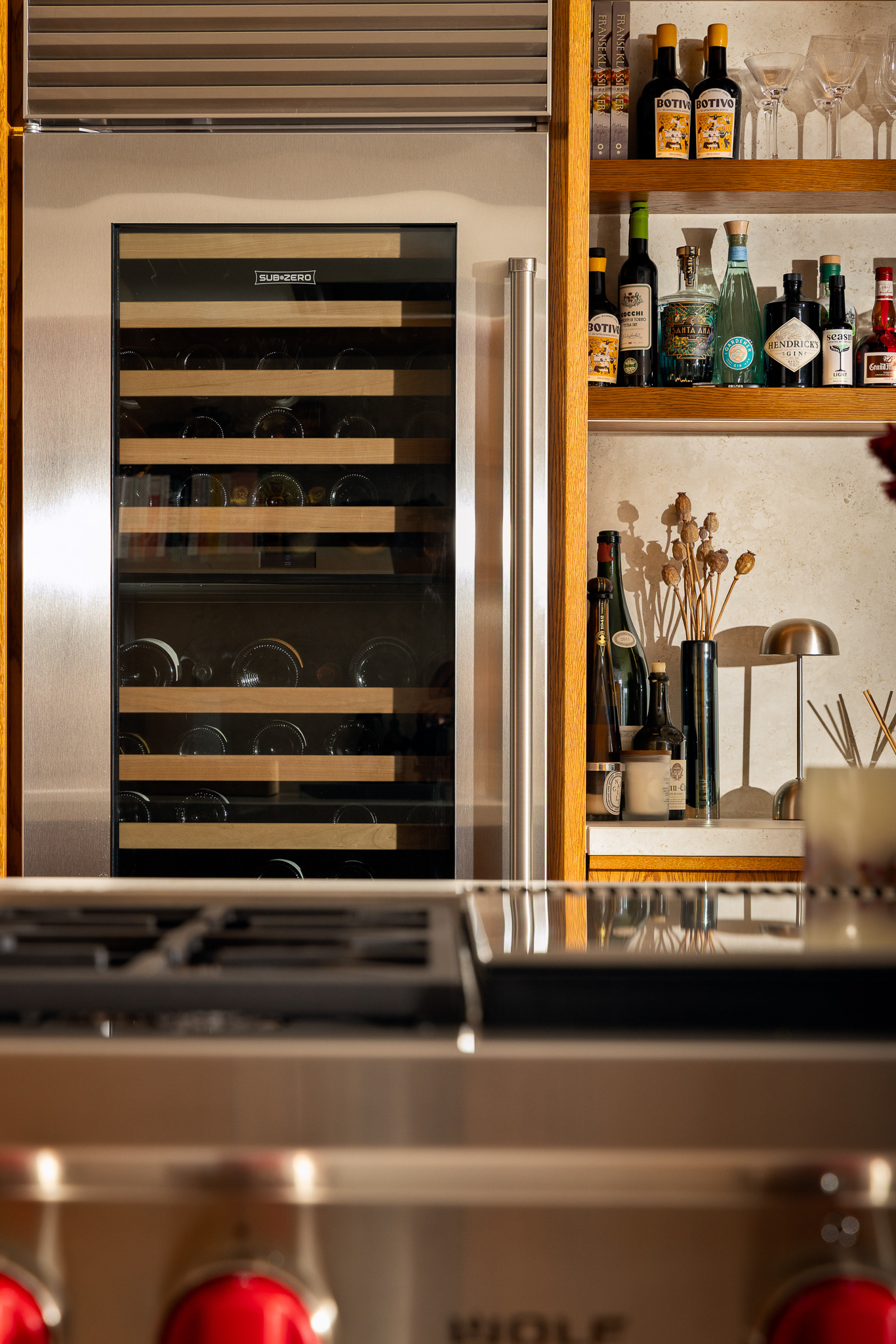 Custom cabinetry framing a full-height Sub-Zero refrigerator, combining performance with timeless design.