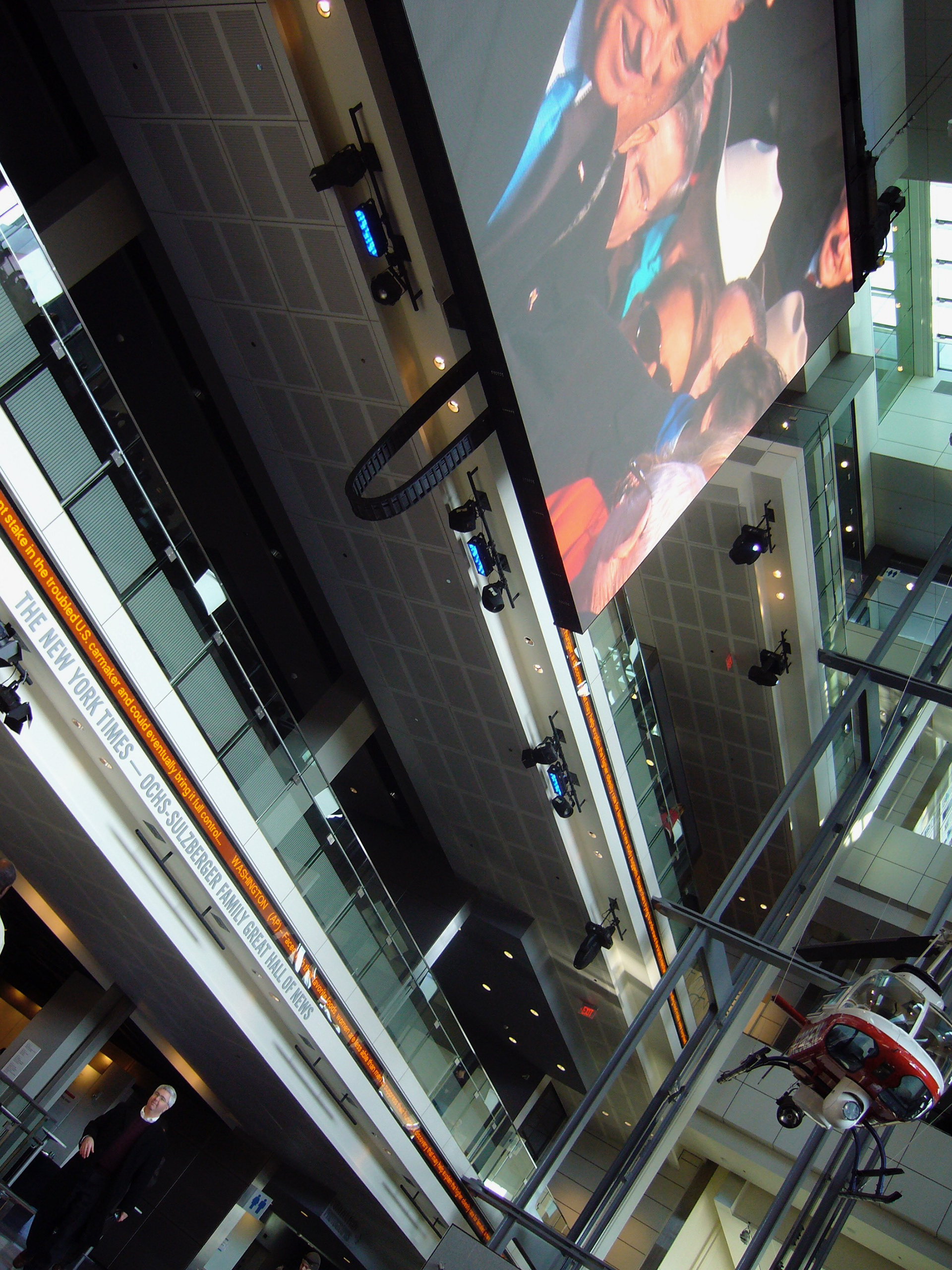 The Newseum with its giant screens showing the Inaugural event