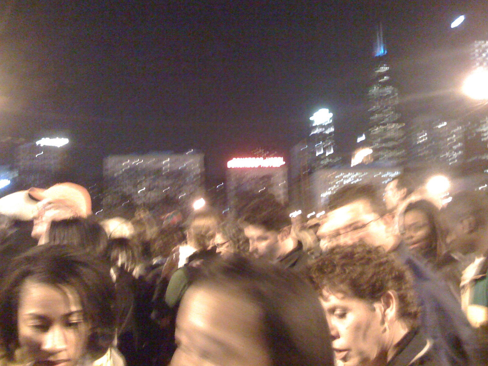 The Chicago skyline is the background for people arriving at the Grant Park event.