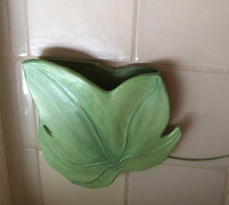 Removable wall vase built into background tile