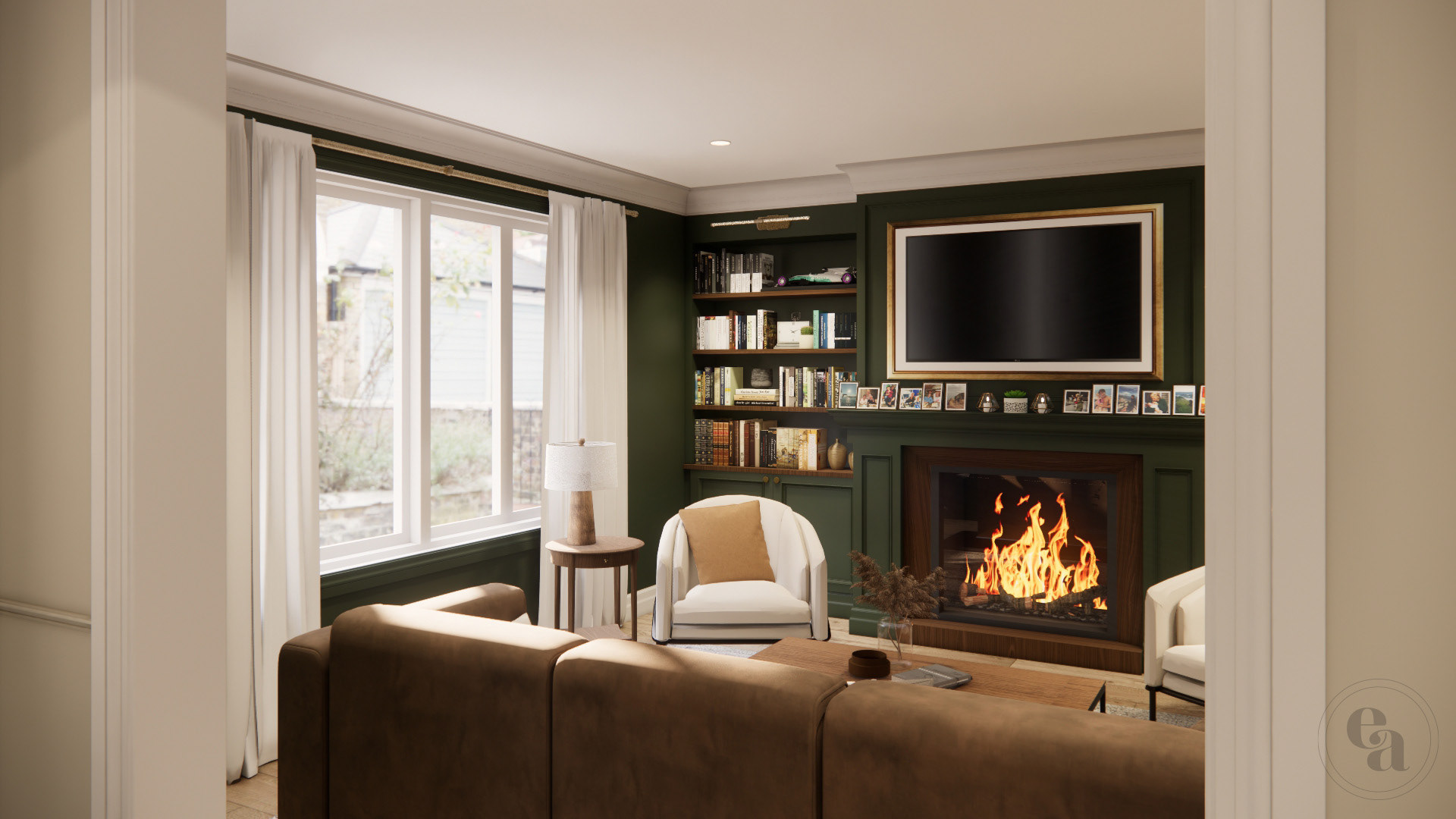 View from foyer into forest green painted traditional style living room, facing the window with cream curtains. A roaring fireplace is ablaze between built in bookshelves lined with books.
