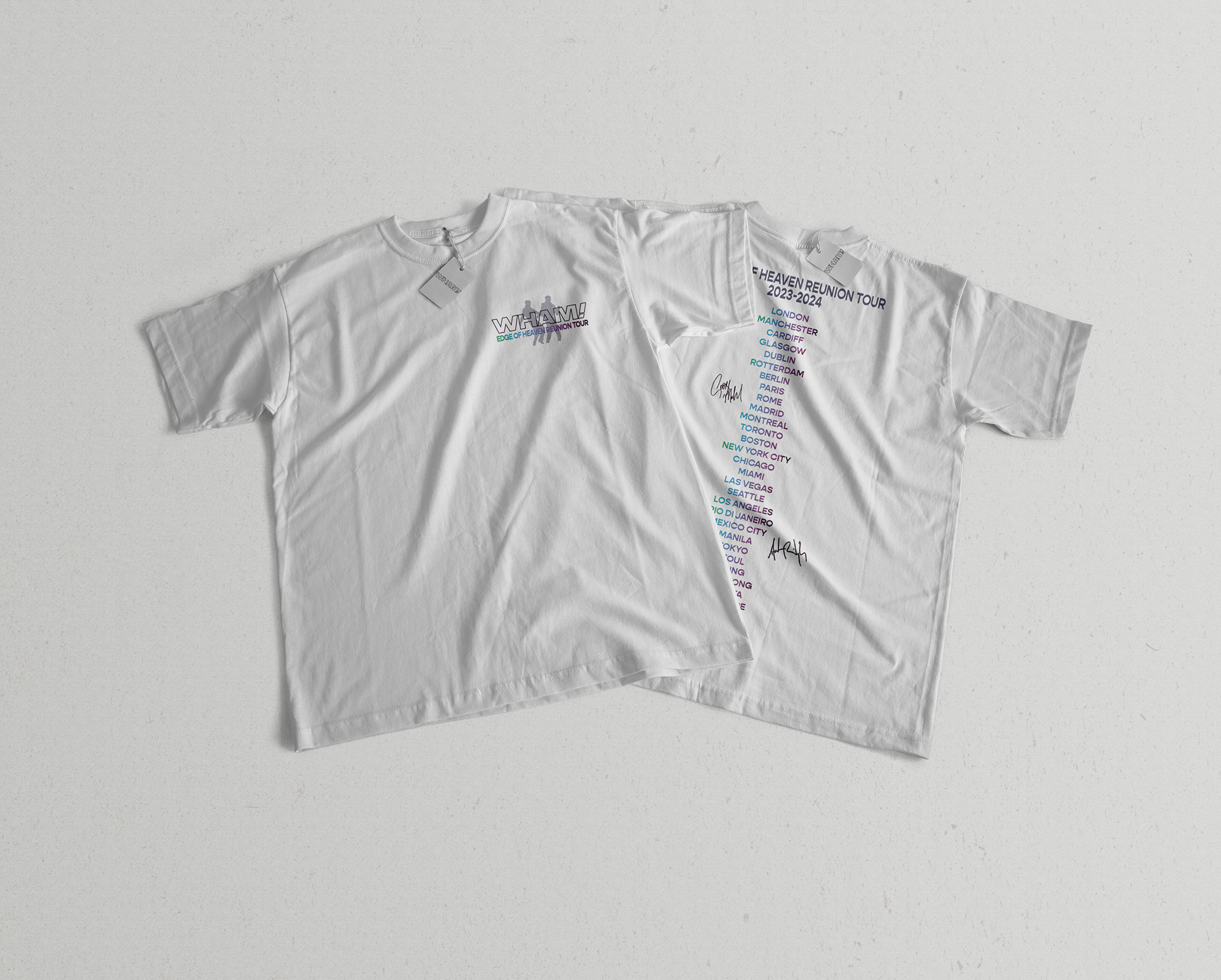 Wham! branded 80s tour t-shirt with tour dates on the back resting on grey surface.