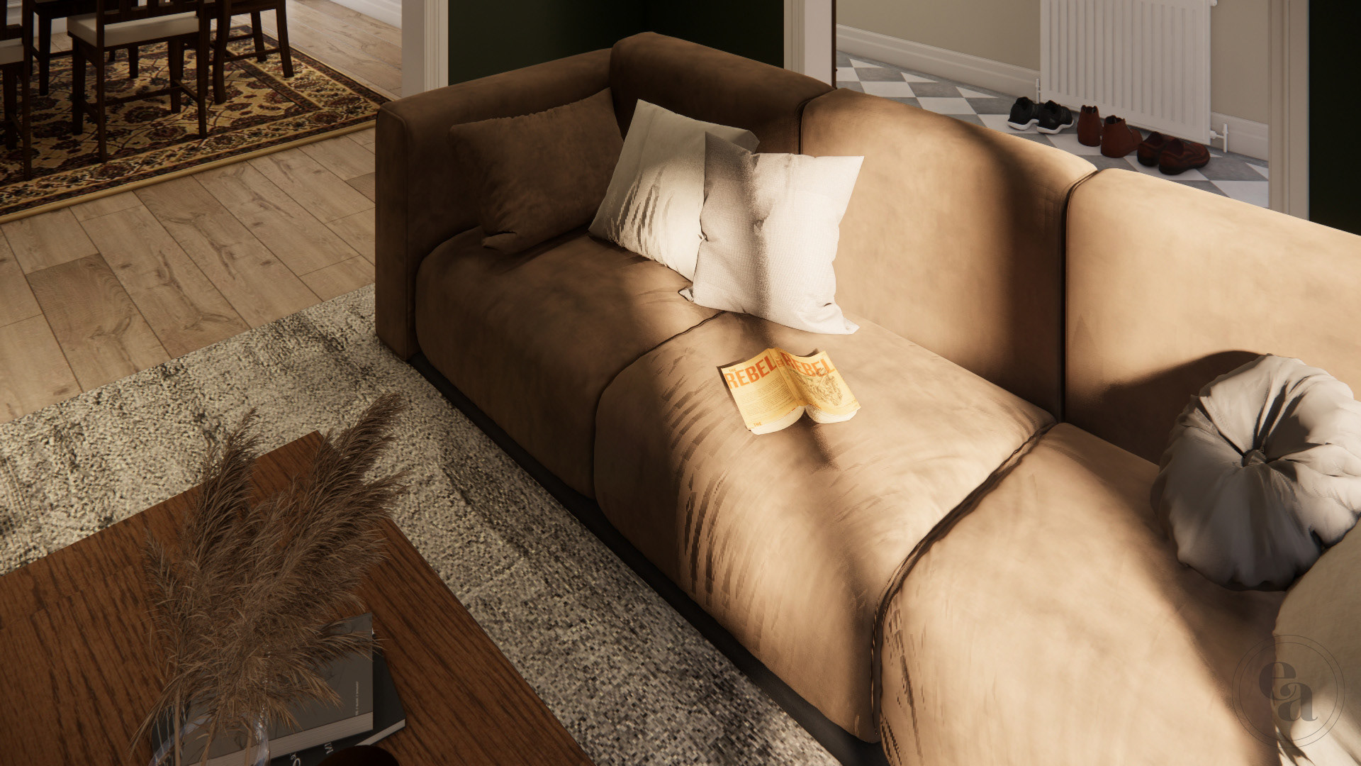 A closeup of the brown leather couch. There are cream and grey throw pillows and an open novel on top of it.