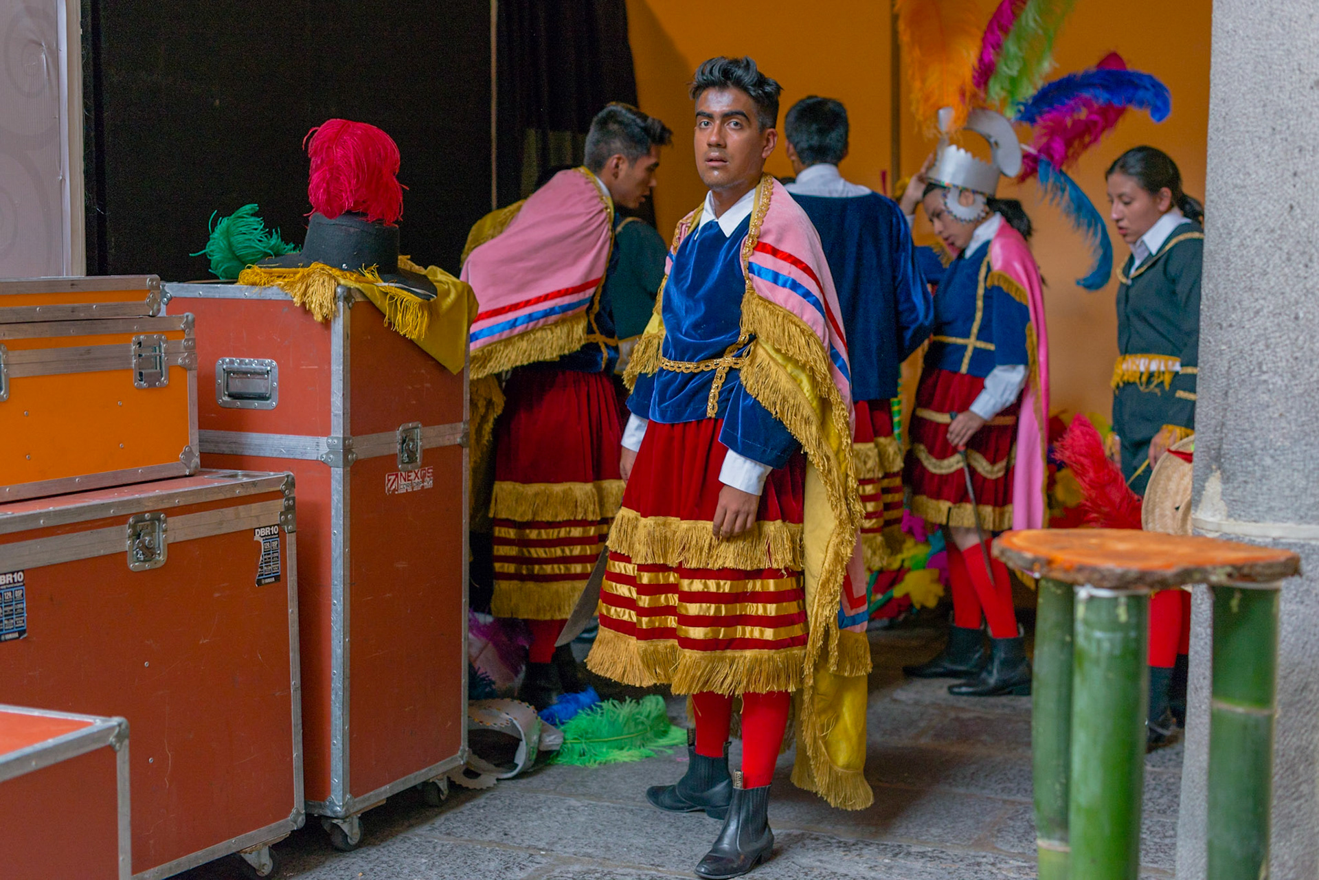 The dance company "Zomalli Tonatiuh" get some rest after dancing "Moors and Christians" from the North Mountain dances of Puebla.
