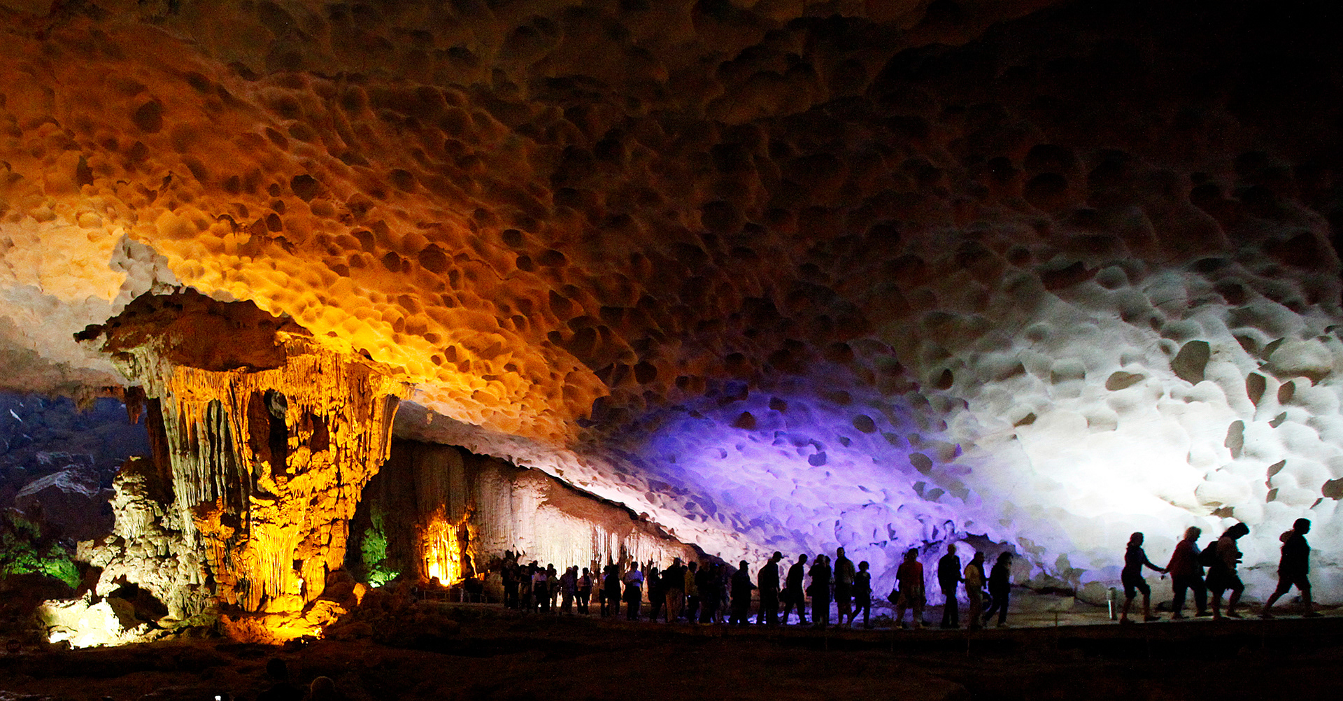 Tourists visit Dau Go cave in Halong Bay, Vietnam. 