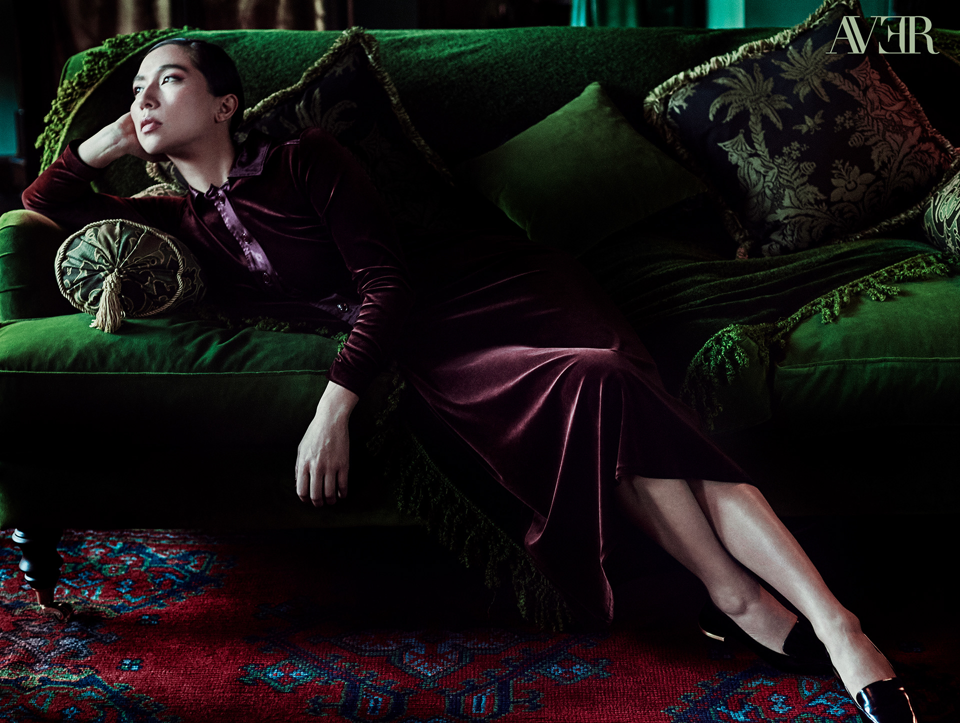 Aoife Hinds reclines on a sofa for an AVER Magazine photoshoot