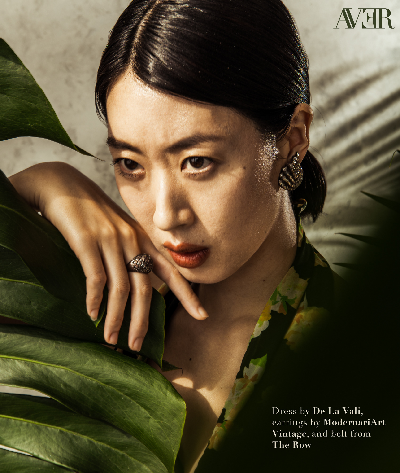 Jiyoung Chang rests her hand on a leaf