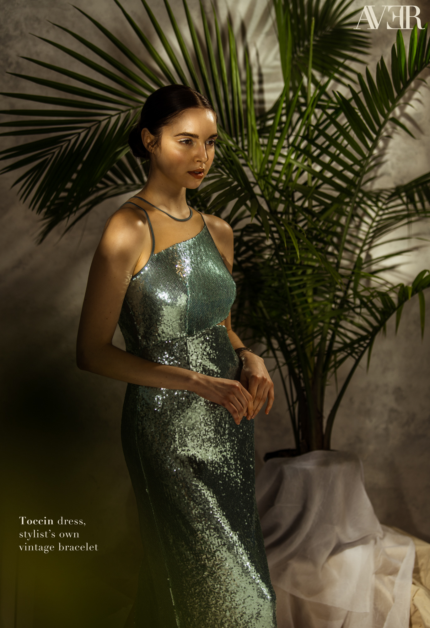 Leah Reynolds of One Model Management stands in a turquoise dress